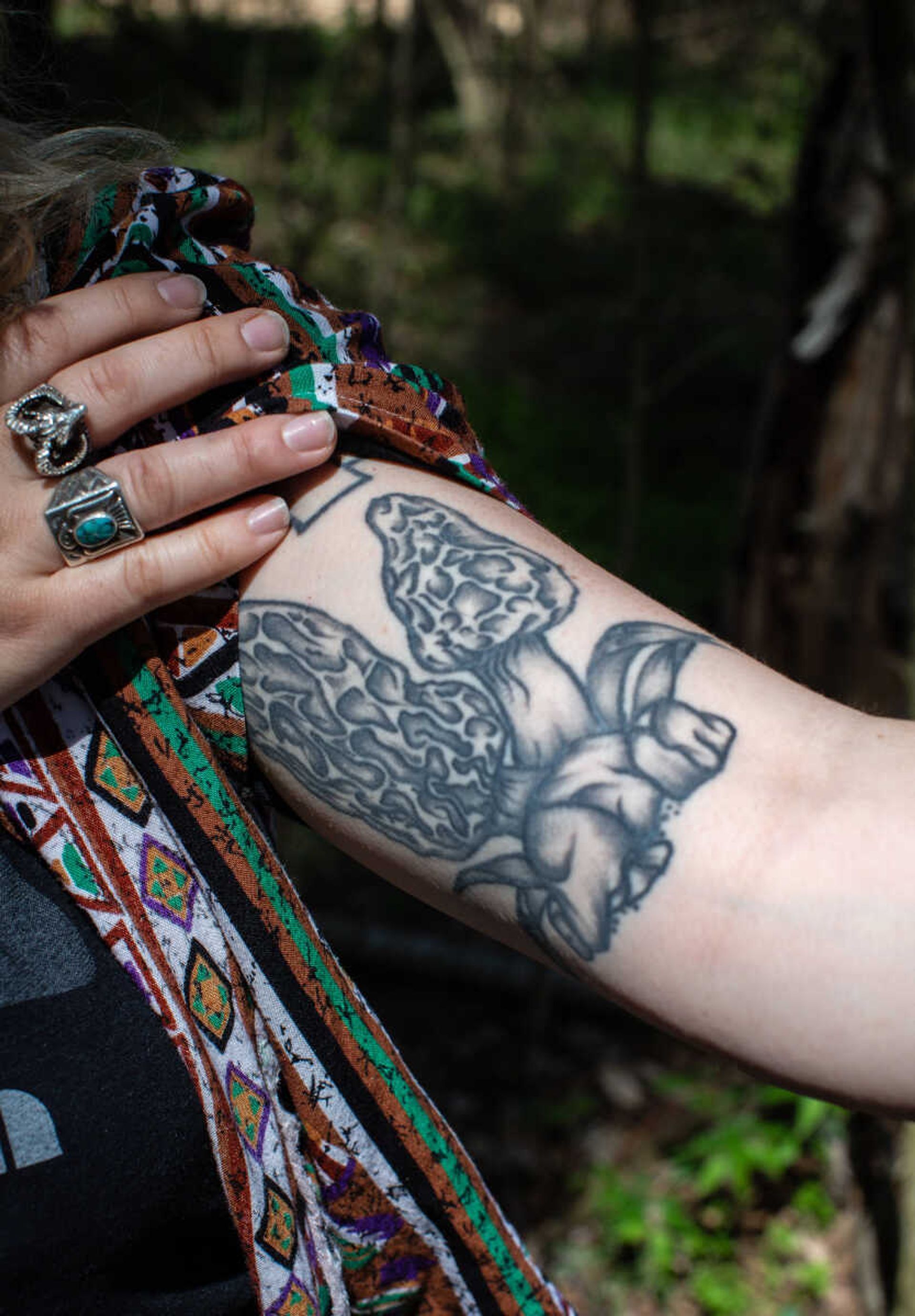 Anna Mae Zembsch shows off her arm tattoo of morel mushrooms. She says she likes morels because they're a first sign of spring and they "just look so cool."