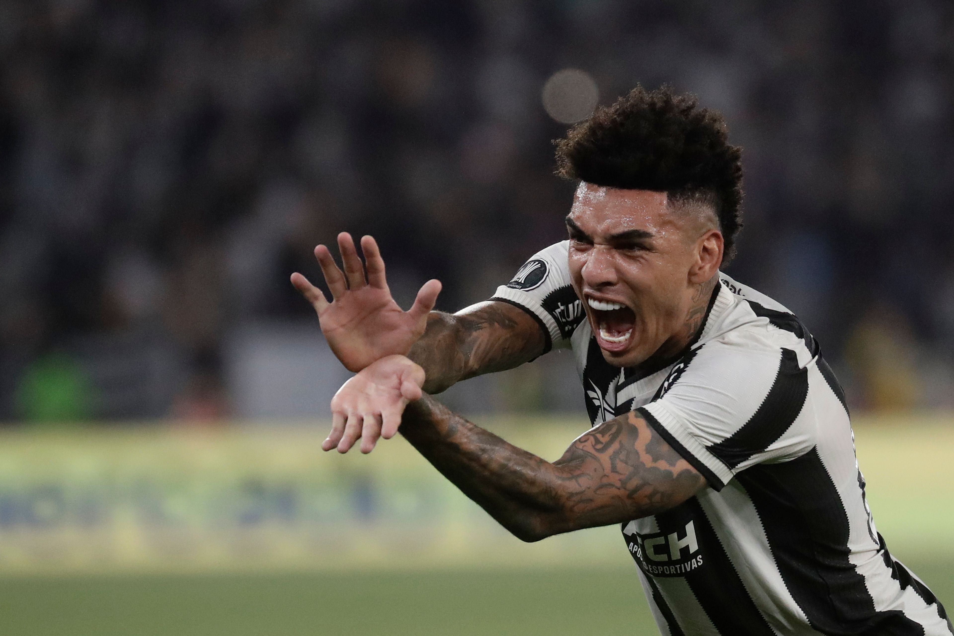 Igor Jesus of Brazil's Botafogo celebrates after scoring his side's fifth goal against Uruguay's Penarol during a Copa Libertadores semifinal first leg soccer match at Nilton Santos stadium in Rio de Janeiro, Wednesday, Oct. 23, 2024. (AP Photo/Bruna Prado)