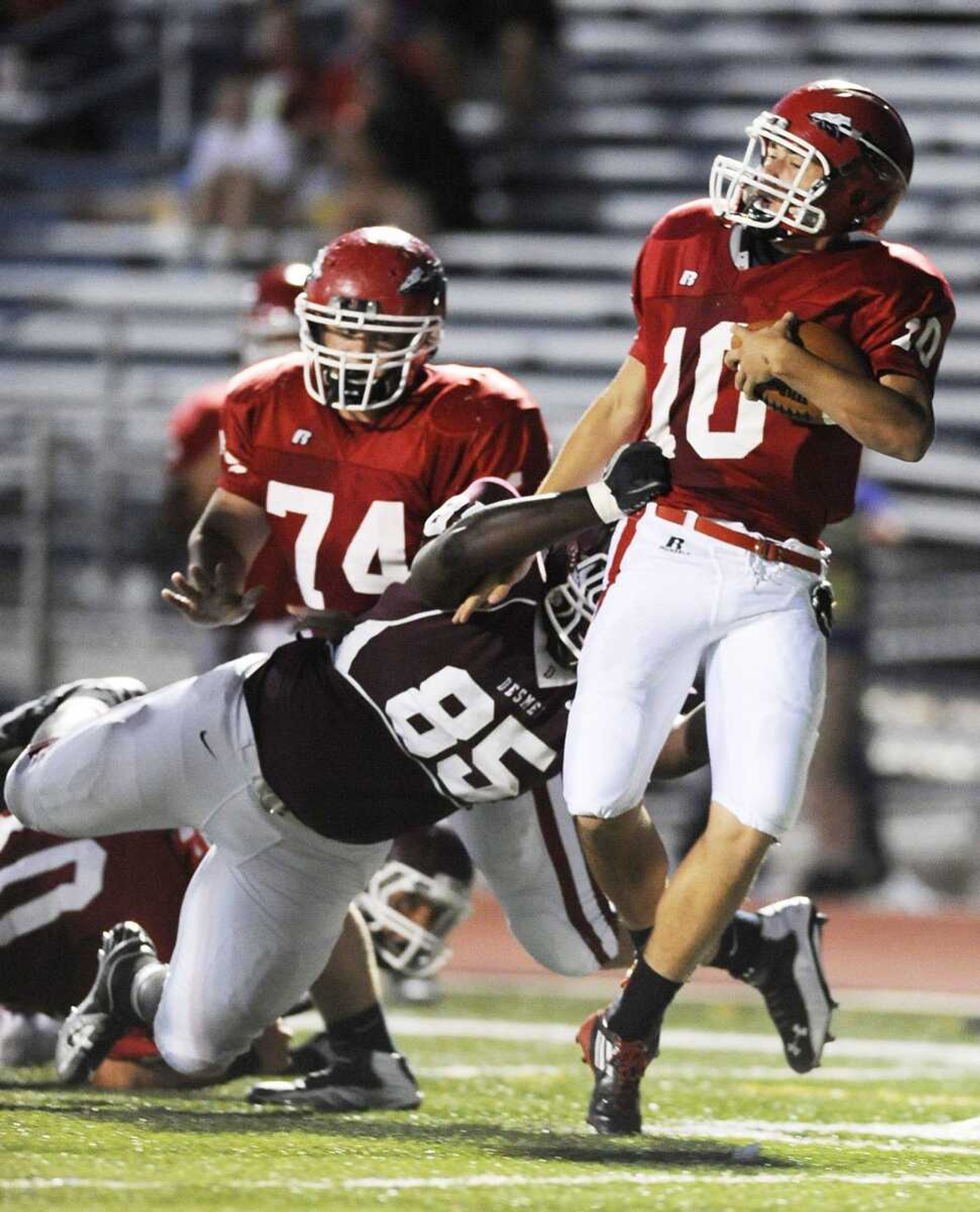 Jackson quarterback Ty Selsor drags a De Smet defender into the end zone for a touchdown Friday.