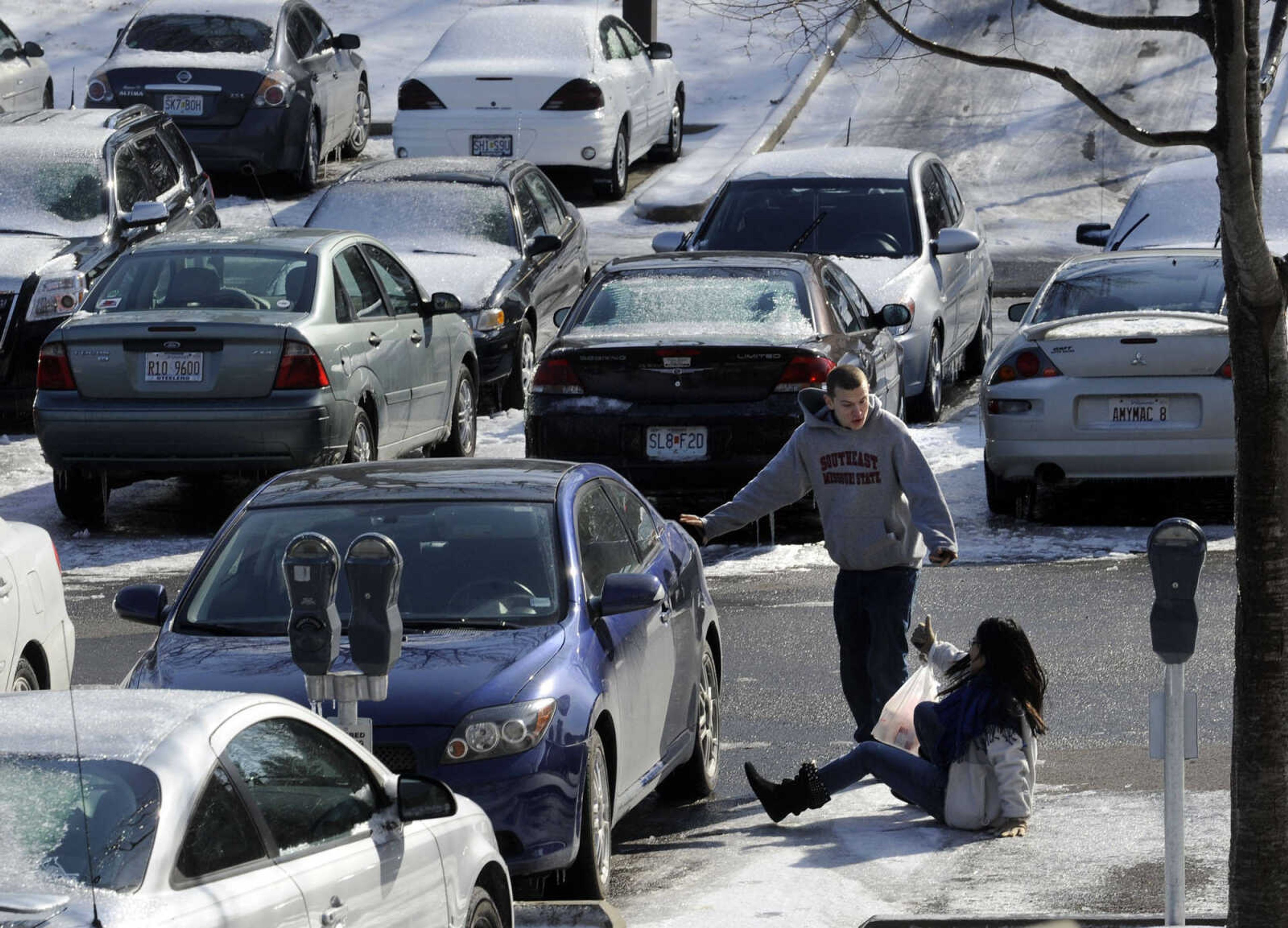 FRED LYNCH ~ flynch@semissourian.com
With classes canceled for the rest of the week due to icy conditions at Southeast Missouri State University, some students still ventured outdoors Thursday, Feb. 6, 2014 to face the elements. One student had a minor mishap on her way to the car.