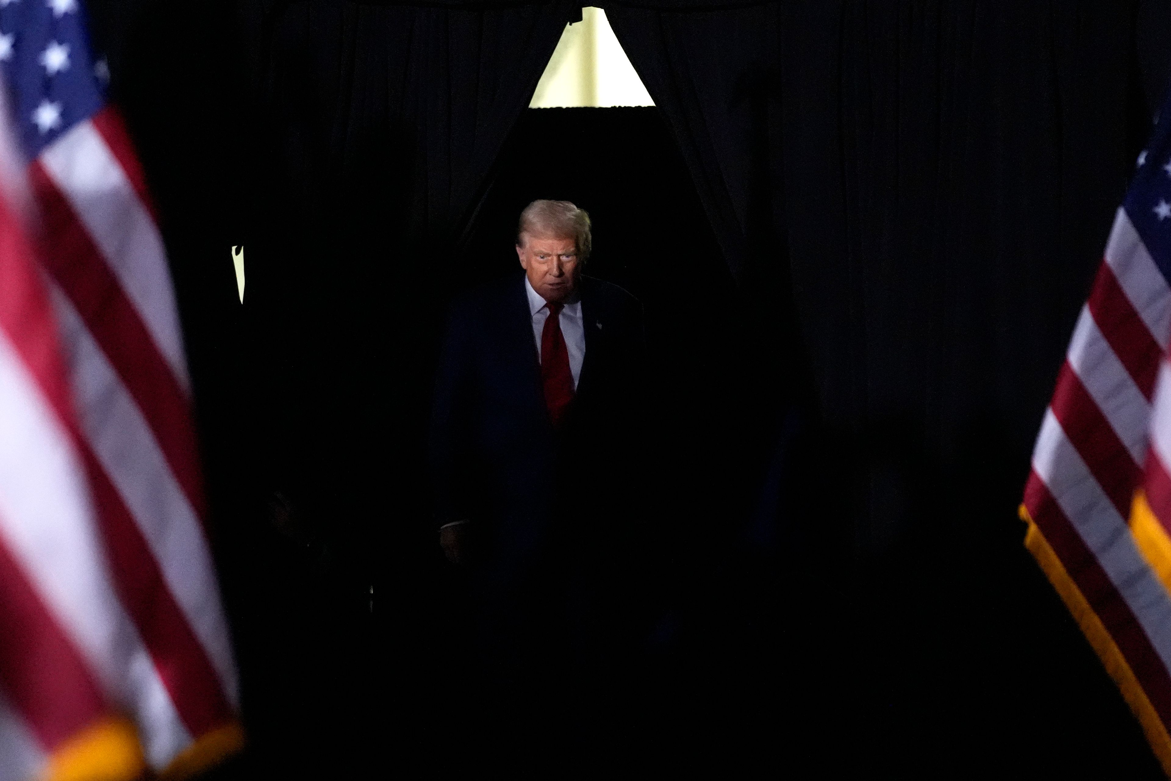 Republican presidential nominee former President Donald Trump arrives to speak during a campaign rally at the Suburban Collection Showplace, Saturday, Oct. 26, 2024, in Novi, Mich. (AP Photo/Alex Brandon)