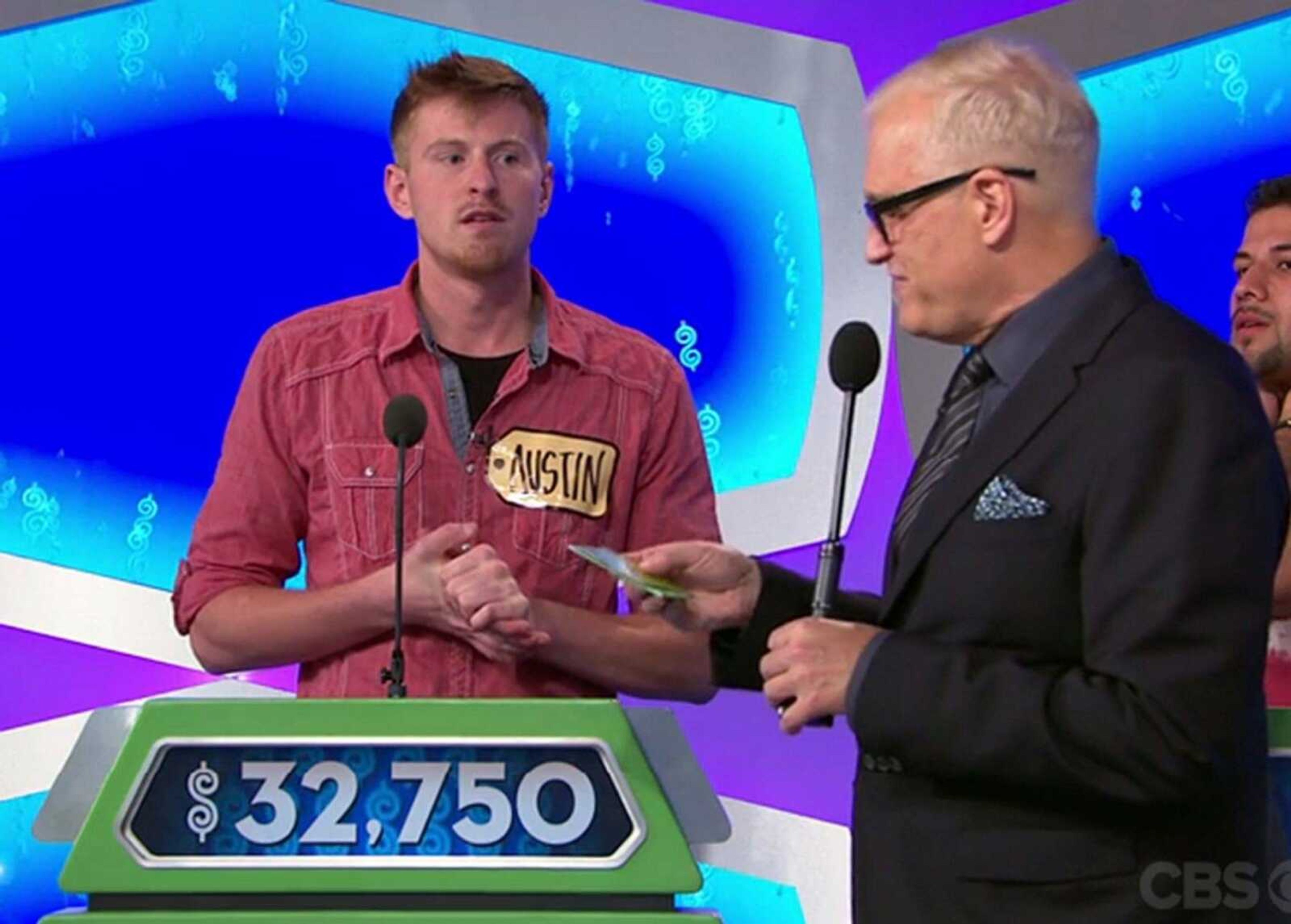 Austin Kwikkel awaits the verdict from host Drew Carey of his guessed price during the Showcase Showdown portion of "The Price Is Right." (Screen capture)