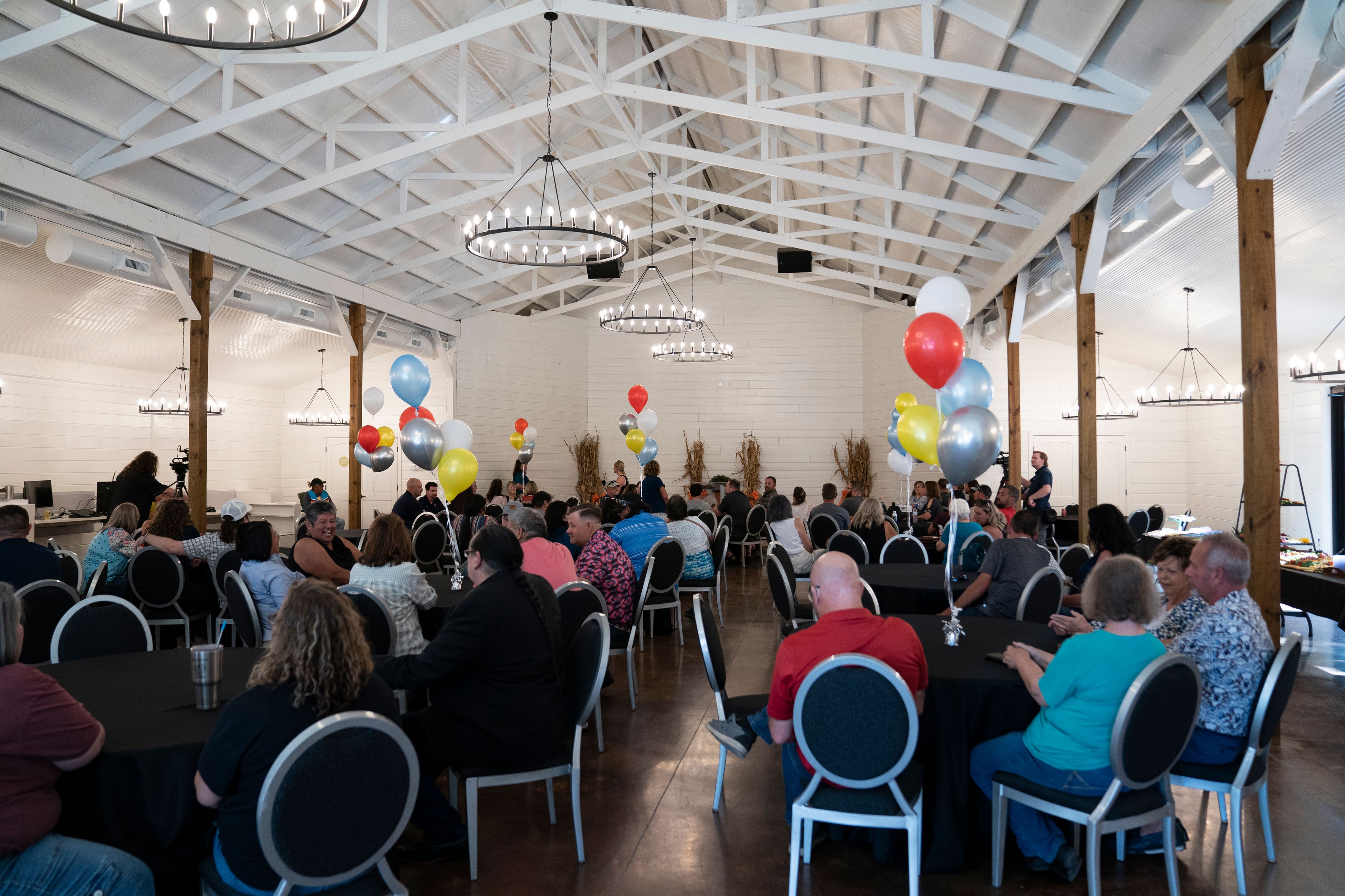 Community members mingle at the opening of the Shawnee Language Center on Friday, September 20, 2024 in Miami, Okla.. (AP Photo/Nick Oxford)