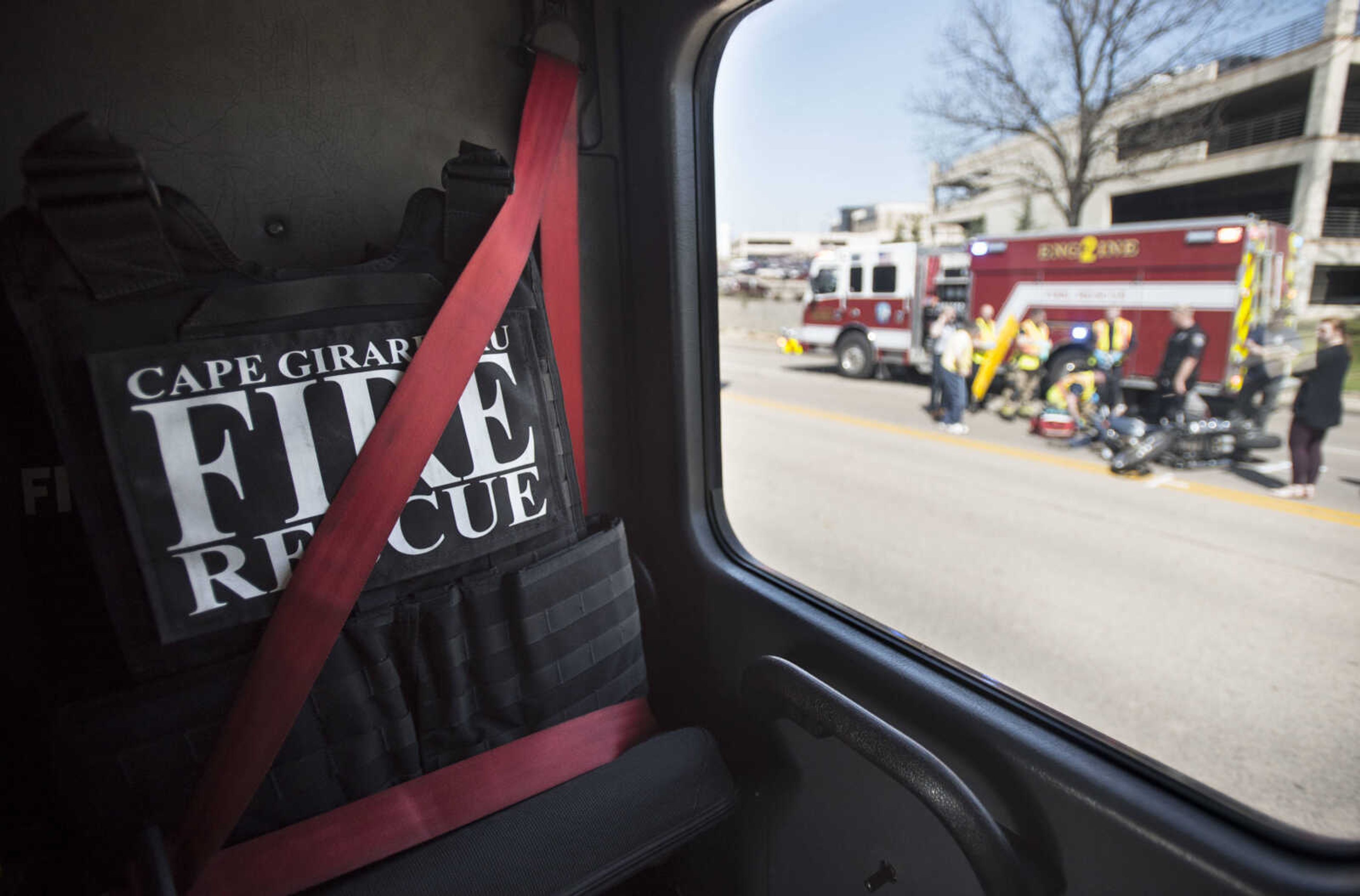 Bulletproof vests sit strapped in the backseat of a firetruck as it passes the scene of a motorcycle wreck on Tuesday, April 17, 2018, in Cape Girardeau.