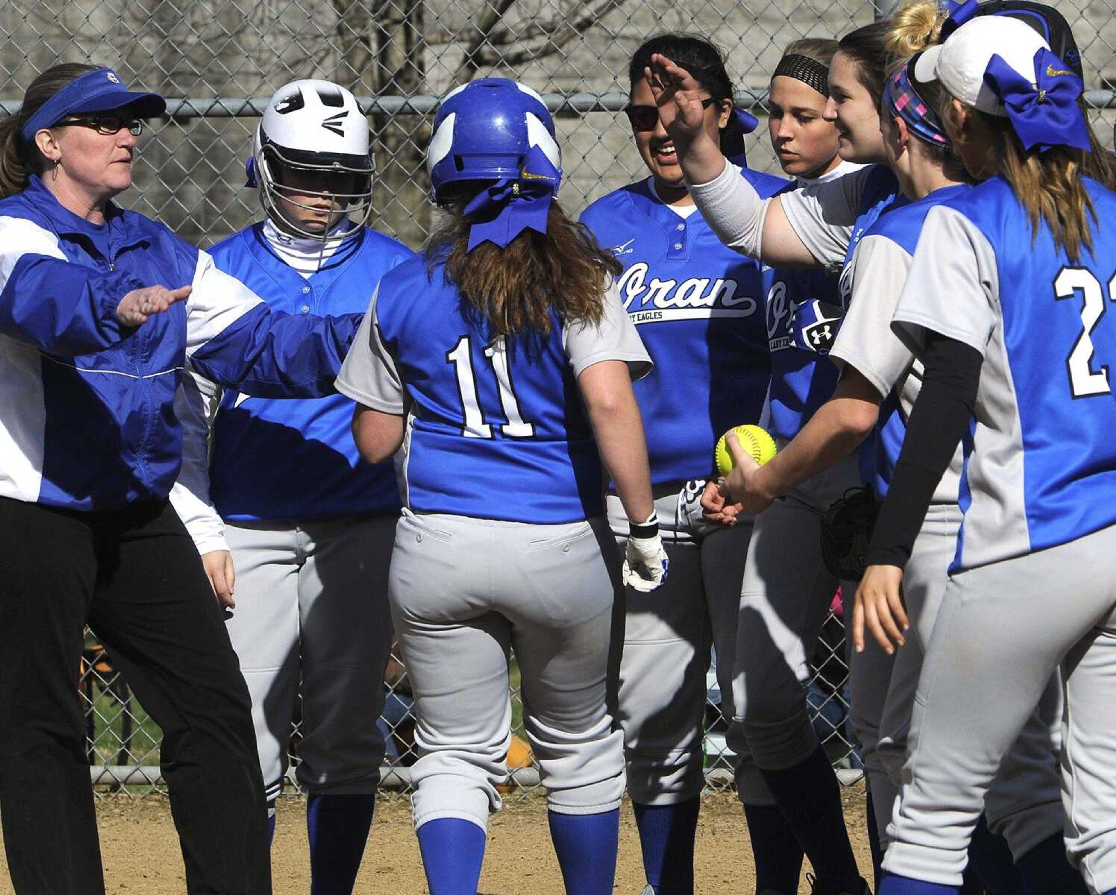 Oran's Claire Ramsey is congratulated by teammates after her solo home run against Advance during the first inning Friday, April 8, 2016 in Oran, Missouri.