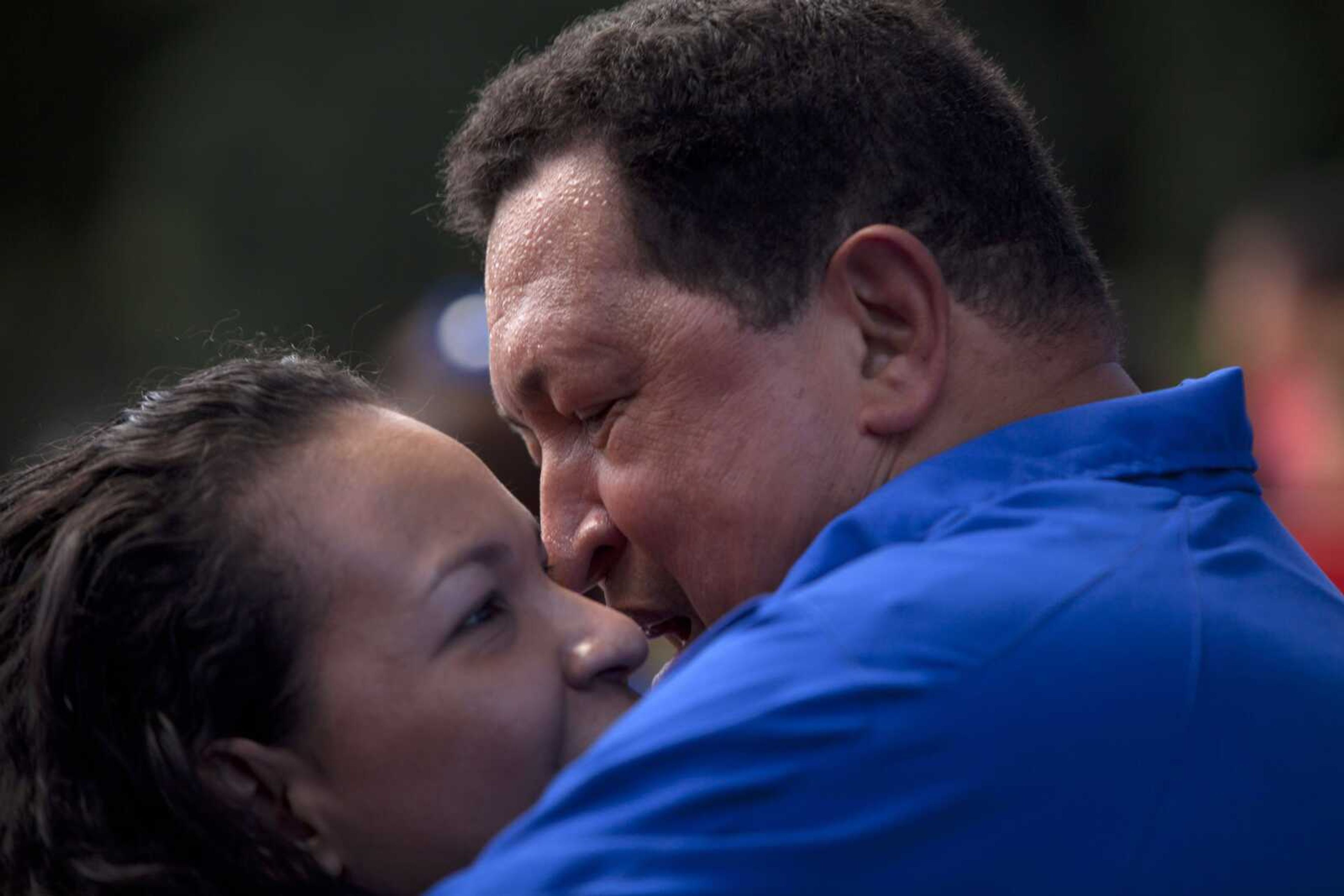 Venezuela's President Hugo Chavez kisses daughter Rosa Virginia during a rally in Maracay, Venezuela, on Wednesday. Chavez will face Henrique Capriles in elections Sunday. (Nicolas Garcia ~ The Associated Press)