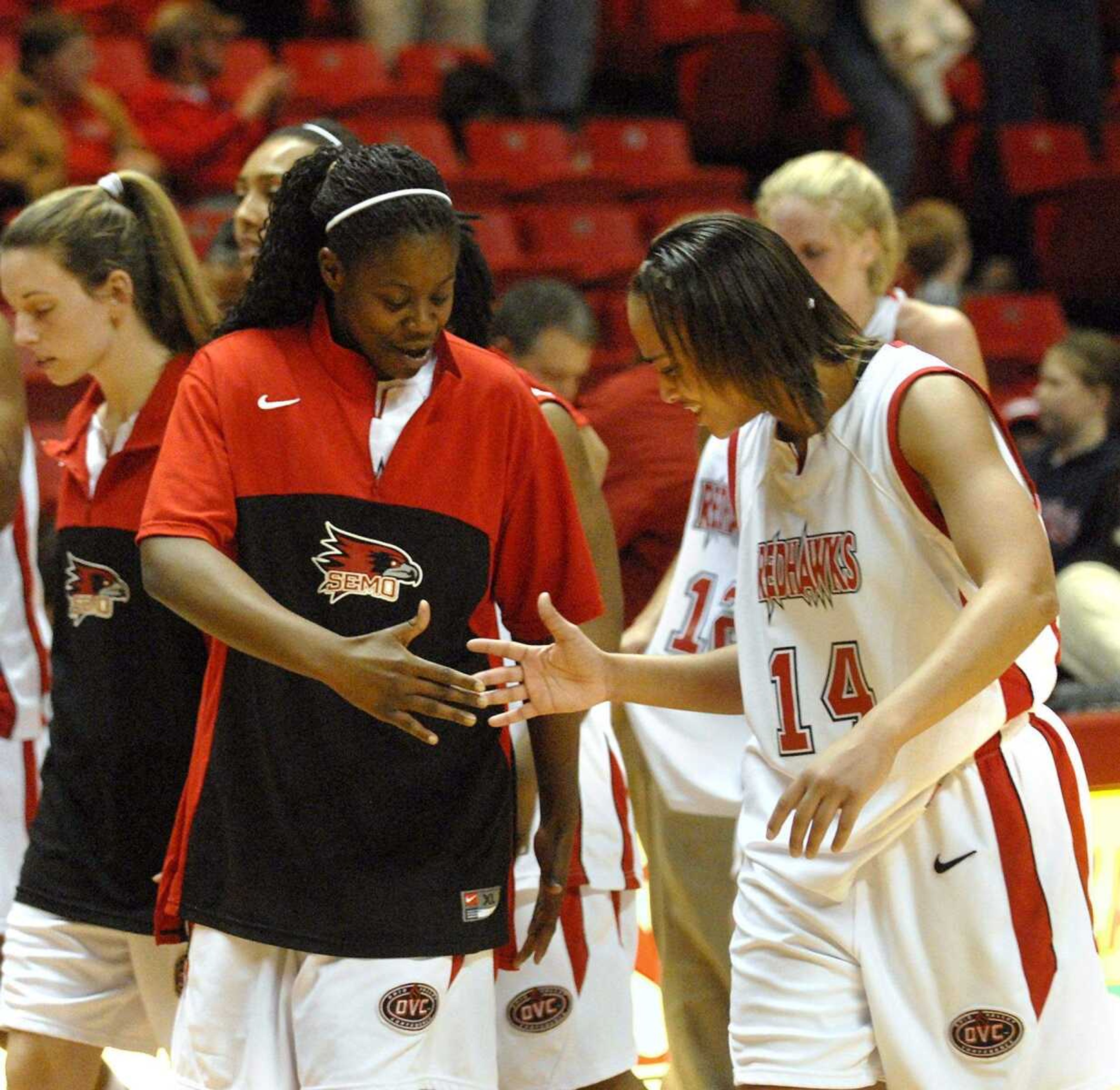 ELIZABETH DODD ~ edodd@semissourian.com
Southeast Missouri's Rochelle Ikeni, left, and Sonya Daugherty celebrate after defeating Eastern Illinois 58-51 Saturday night at the Show Me Center.