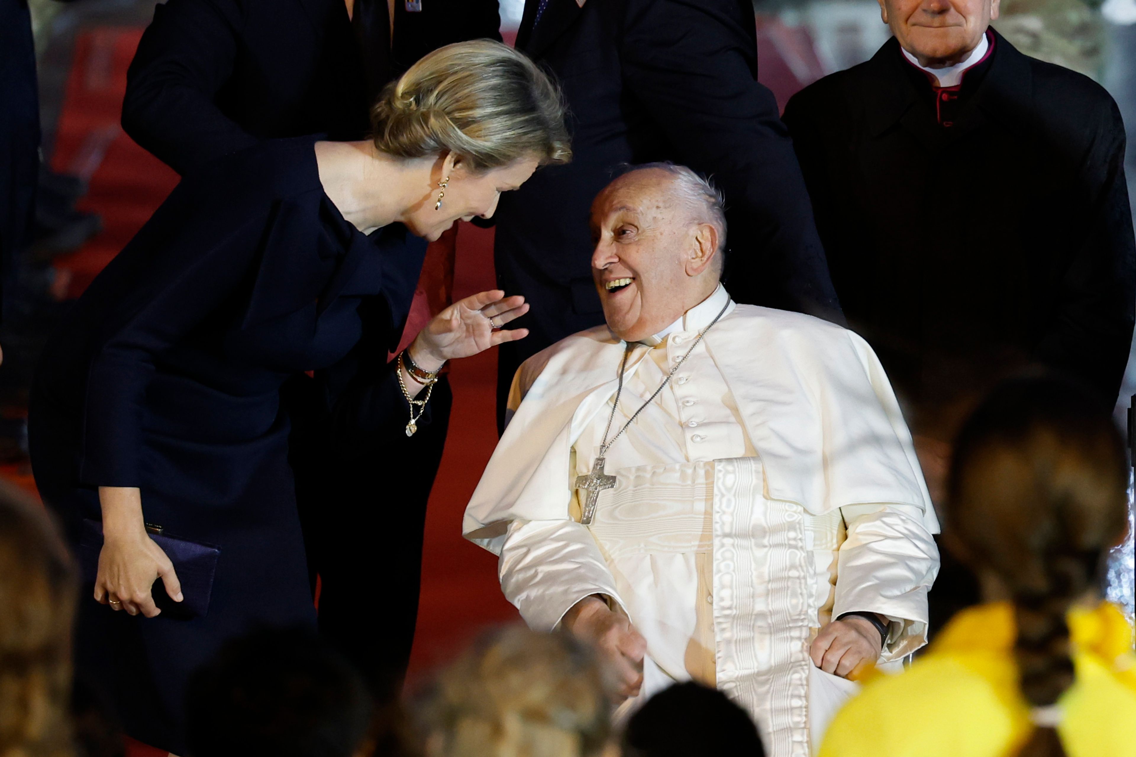 Pope Francis talks to Queen Mathilde of Belgium upon his arrival at the Melsbroek air base in Steenokkerzeel, near Brussels, on the first day of his four-day visit to Luxembourg and Belgium, Thursday, Sept. 26, 2024. (AP Photo/Geert Vanden Wijngaert)