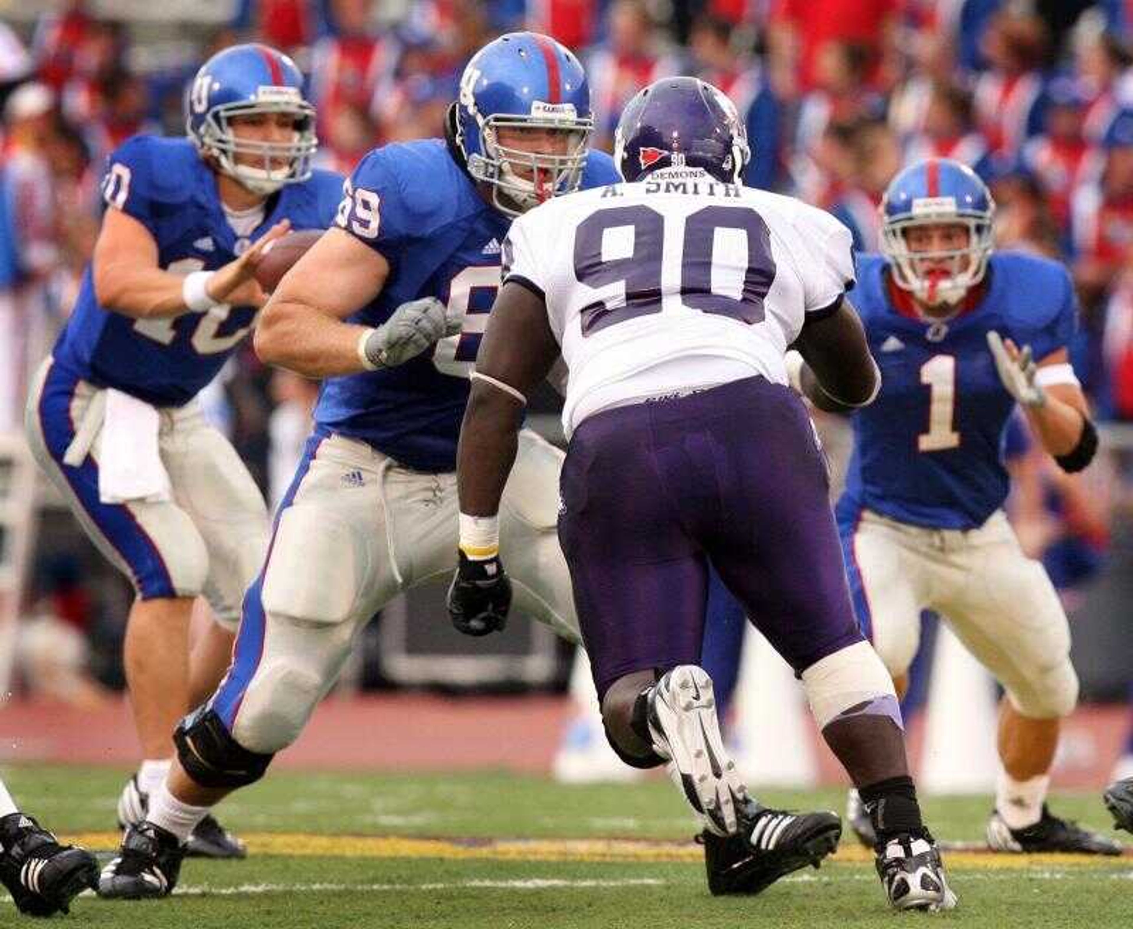 Senior Travis Dambach (69) blocked for quarterback Kerry Meier during the season-opening game with Northwestern State. The Jayhawks are 6-5 with a three-game winning streak heading into Saturday's game at Missouri. (University of Kansas photo)