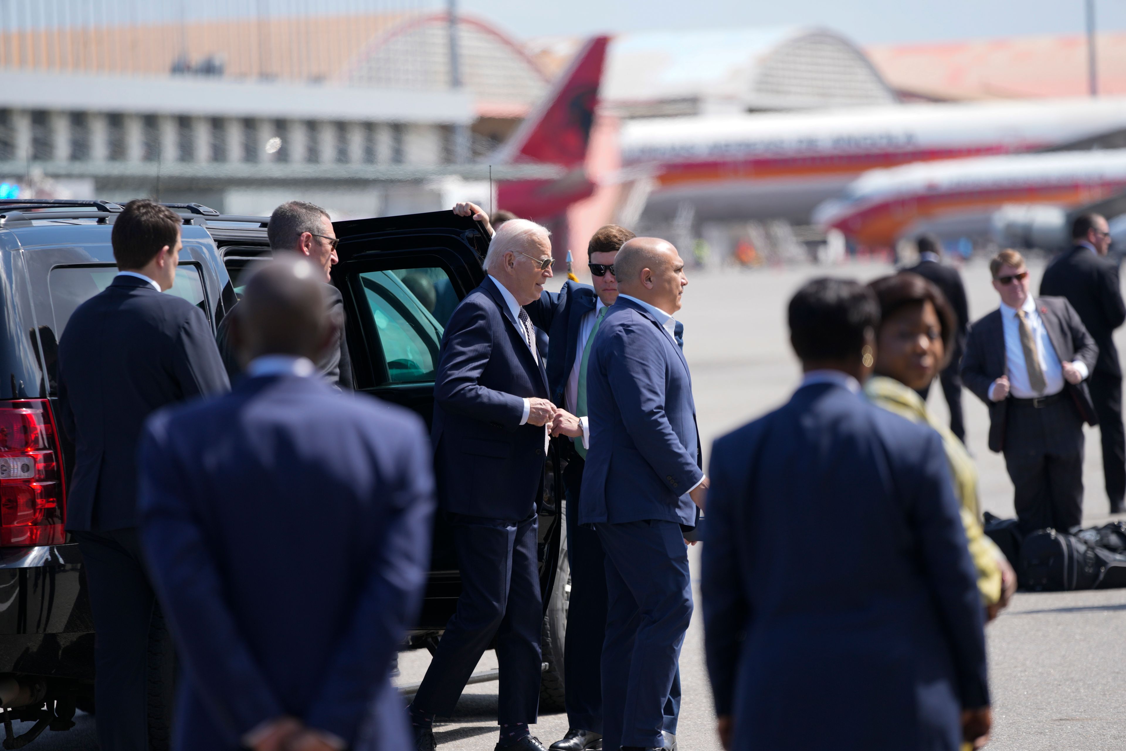 President Joe Biden walks to board Air Force One at Quatro de Fevereiro International Airport in the capital, Luanda, Angola, on Wednesday, Dec. 4, 2024. (AP Photo/Ben Curtis)