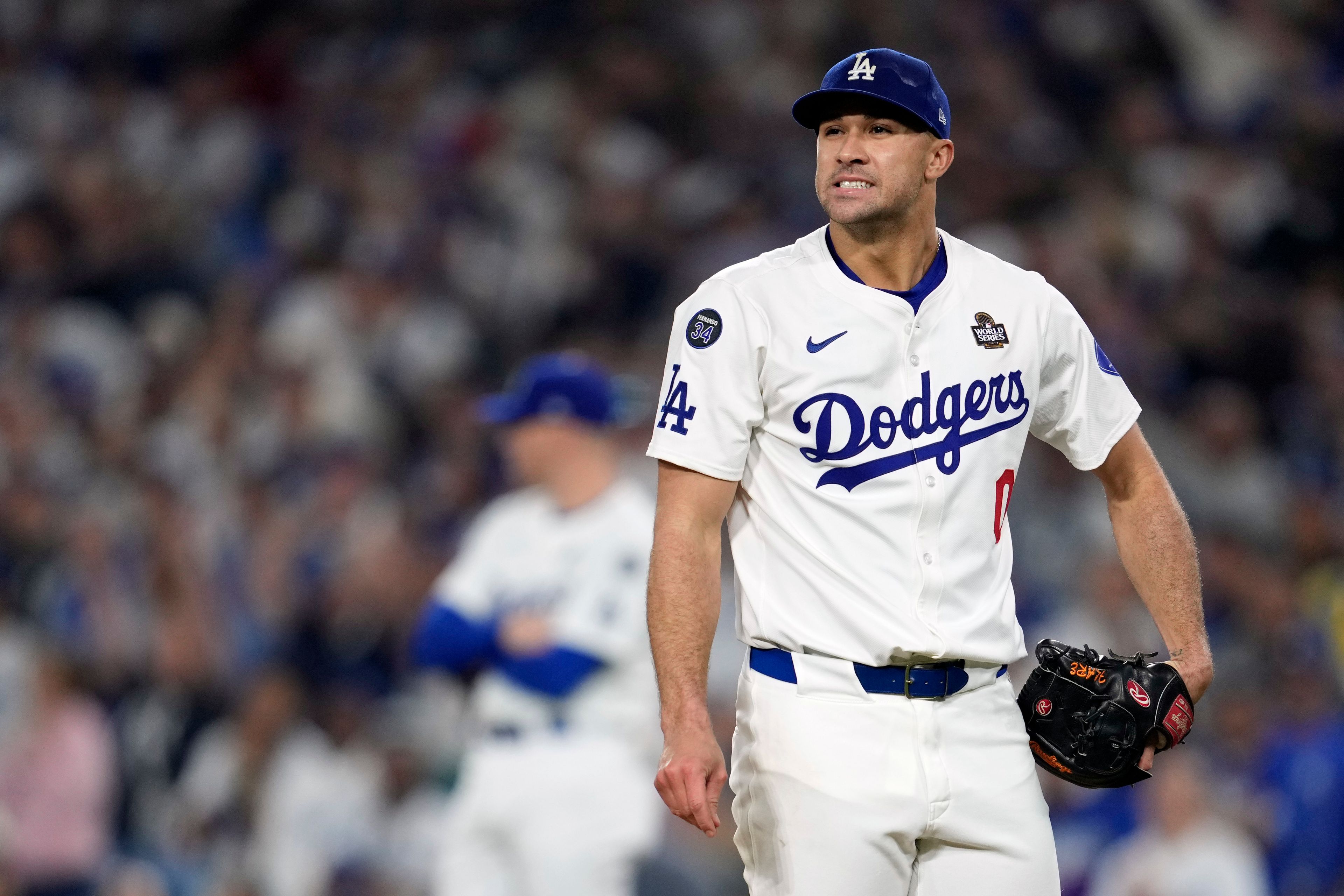 Los Angeles Dodgers' Jack Flaherty reacts after giving up a two-run home run to New York Yankees' Giancarlo Stanton during the sixth inning in Game 1 of the baseball World Series, Friday, Oct. 25, 2024, in Los Angeles. (AP Photo/Godofredo A. Vásquez)