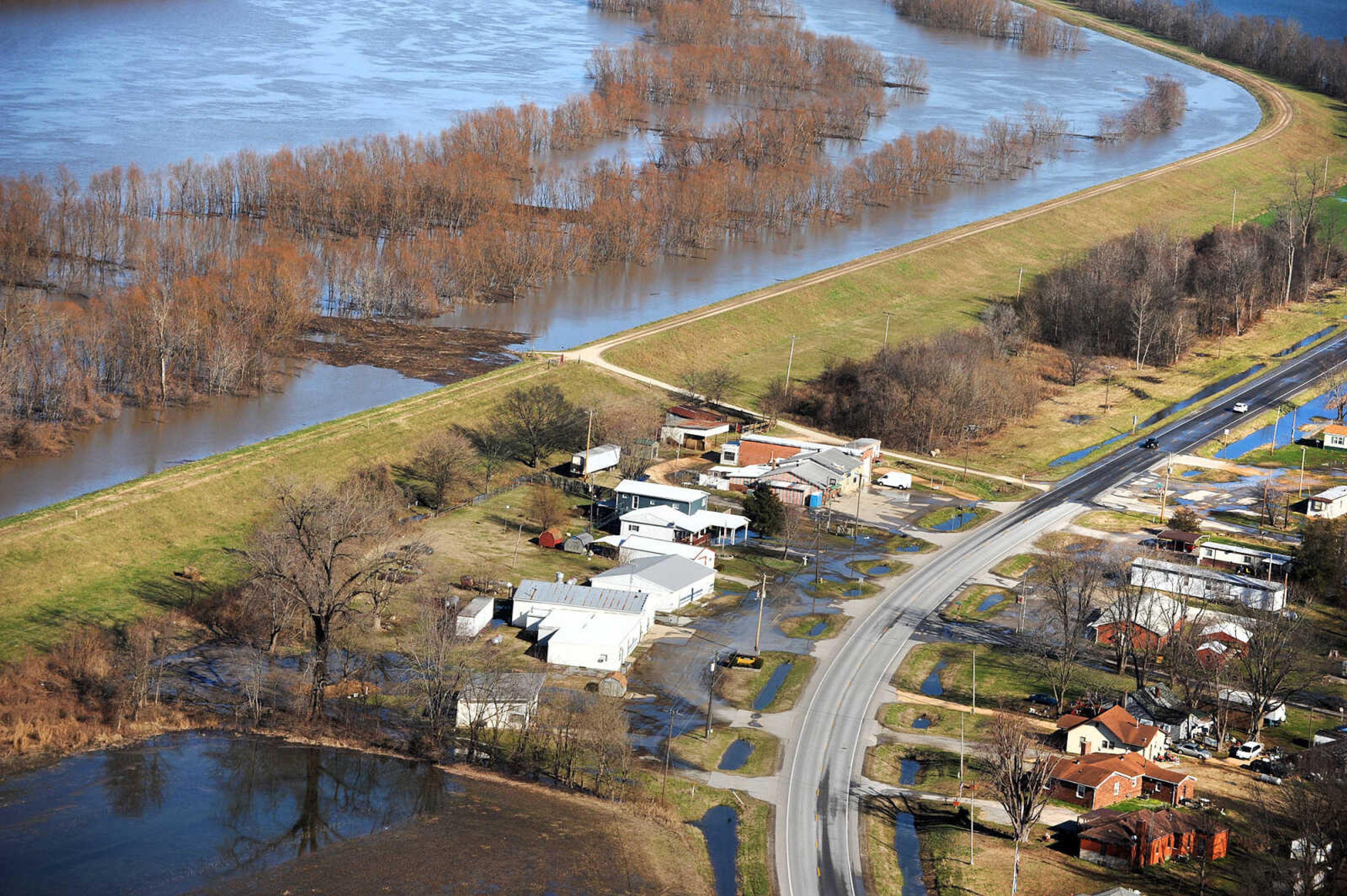 LAURA SIMON ~ lsimon@semissourian.com

Water seeps into portions of McClure, Illinois as the swollen Mississippi River pushes against the levee protecting the Southern Illinois town, Saturday, Jan. 2, 2016.