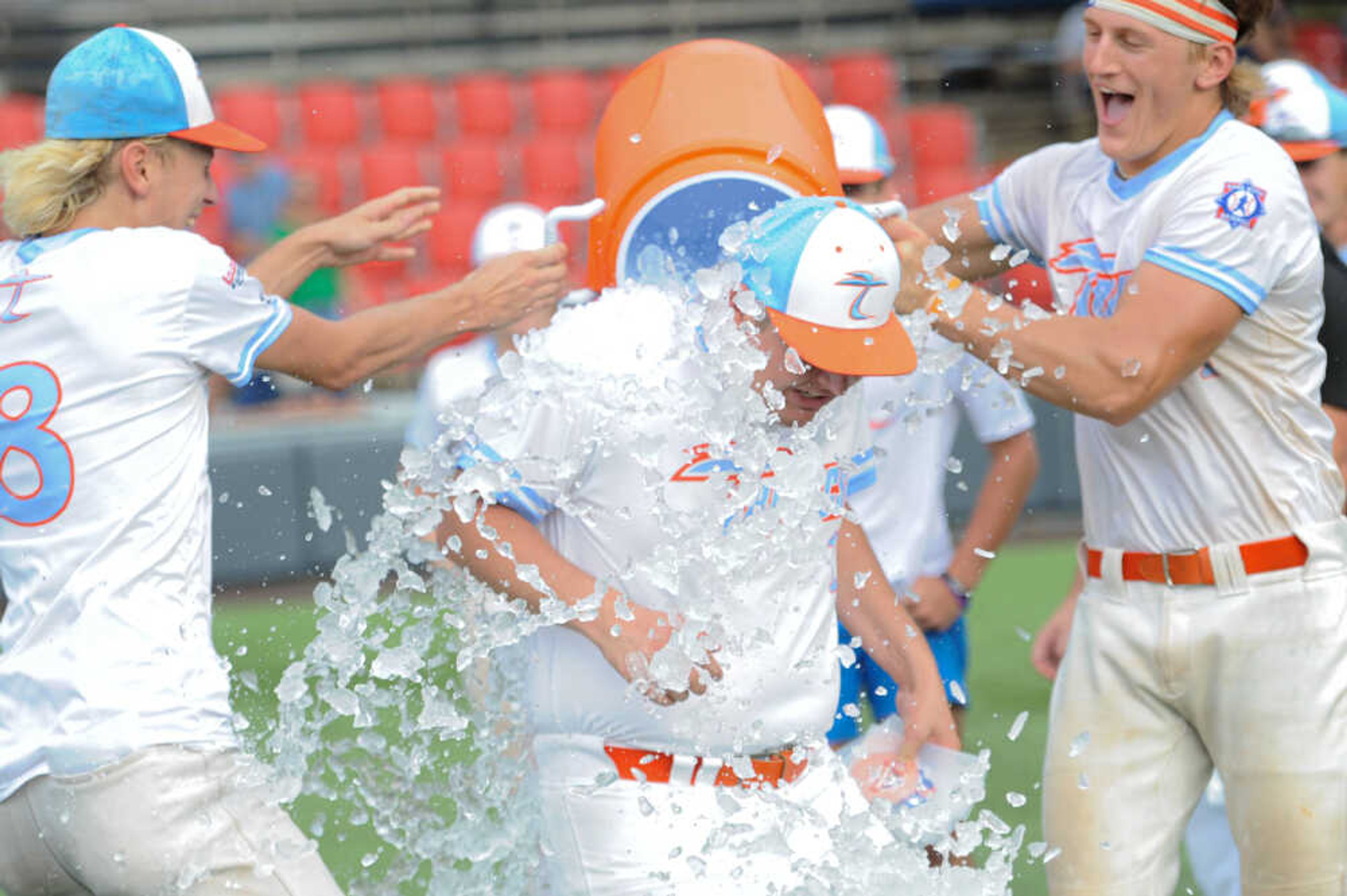 Southeast's Dustin Schwartz (center) gets the "Gatorade Shower" following the August 15, 2024 Babe Ruth World Series third-place game between the Charleston Fighting Squirrels and the Southeast Tropics at Capaha Field in Cape Girardeau, Mo. Southeast defeated Charleston, 11-2 in five innings.