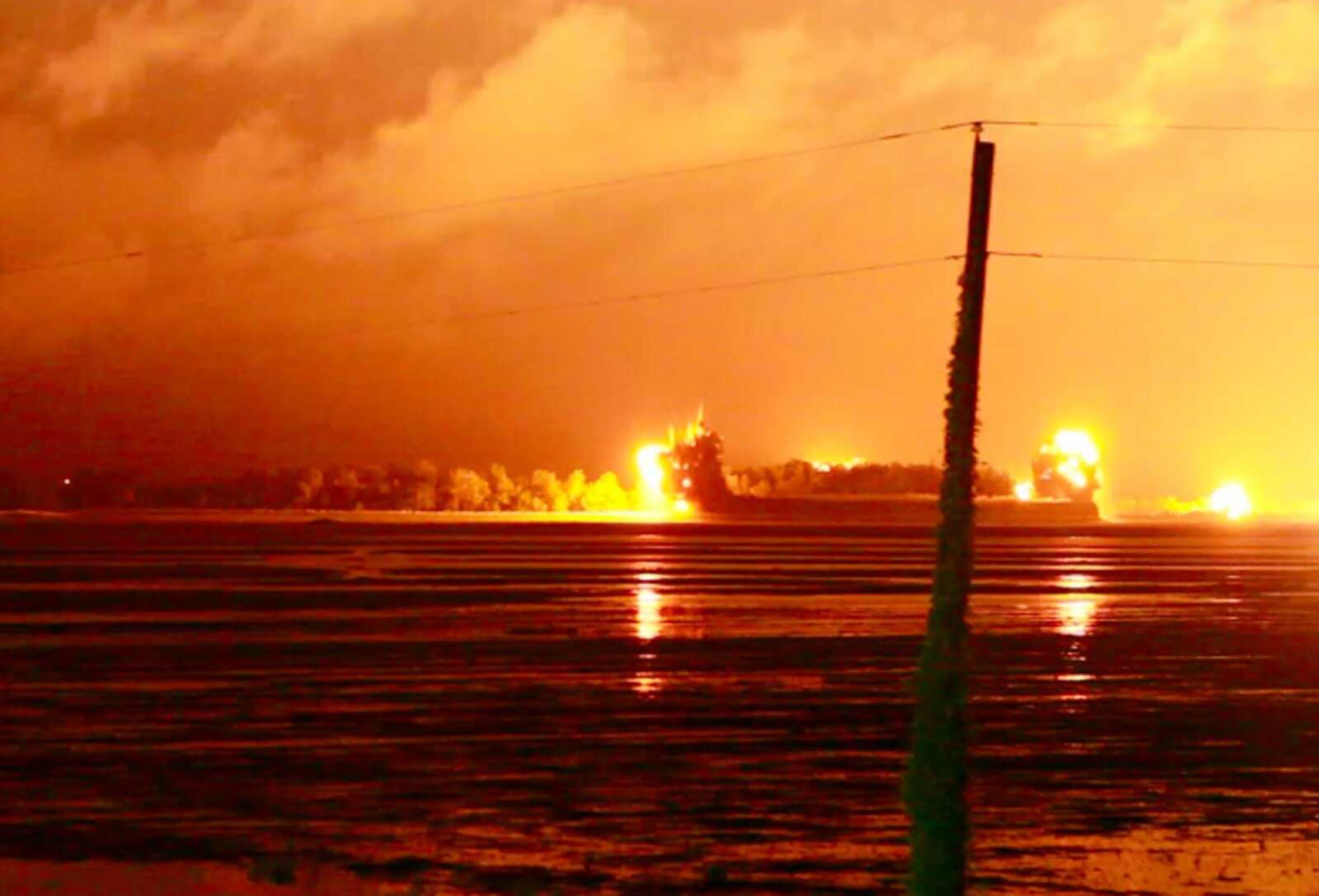 An explosion lights up the night sky as the the U.S. Army Corps of Engineers blows an 11,000 foot hole in the Birds Point levee in Mississippi County, Mo. on Monday, May 2, 2011. Army Corps of Engineers' Maj. Gen. Michael Walsh gave the order to blow a two-mile hole into the Birds Point levee in southeast Missouri, which will flood 130,000 acres of farmland in Missouri's Mississippi County but protect nearby Cairo, Ill. (AP Photo/St. Louis Post-Dispatch, David Carson)