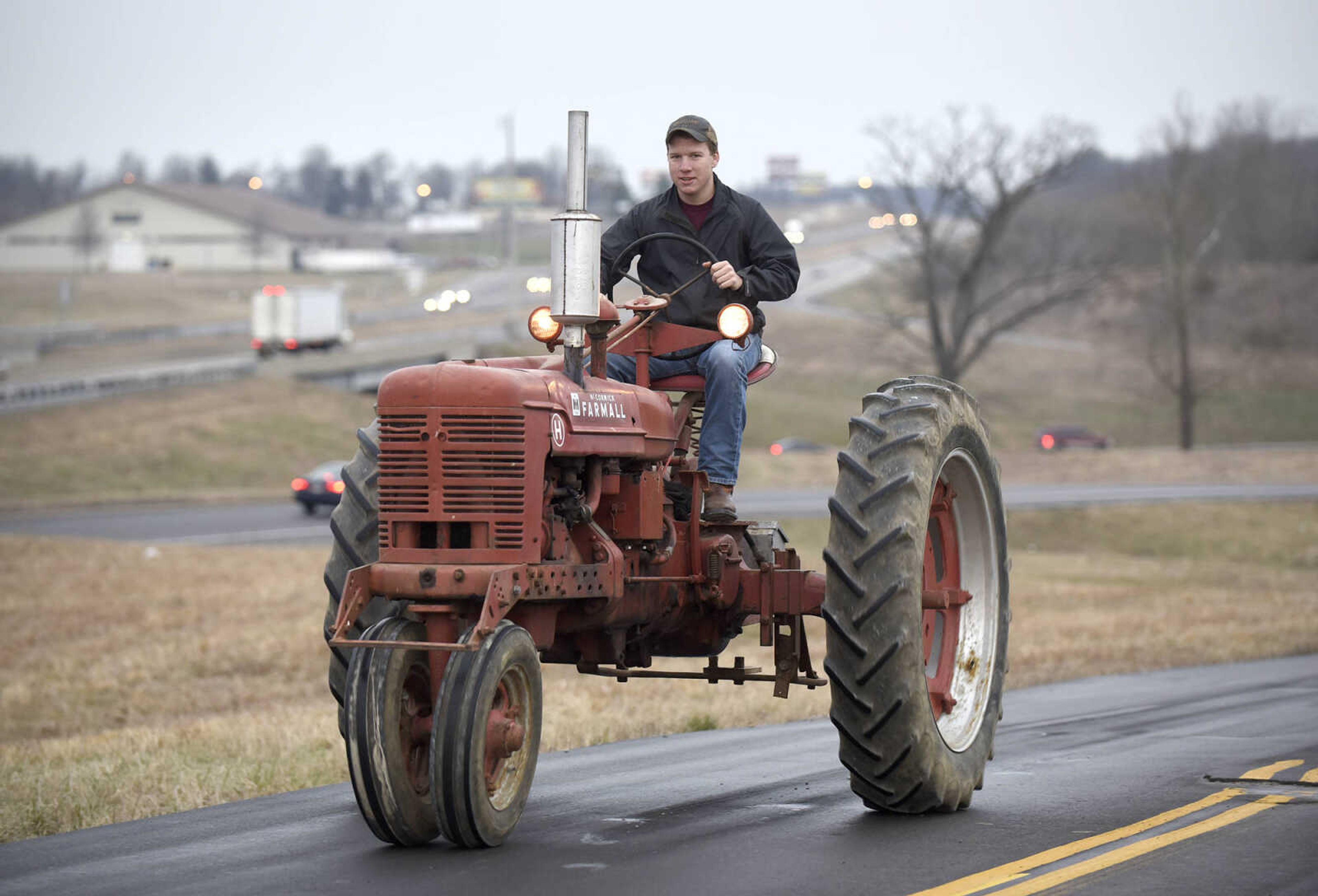 Saxony Lutheran High School FFA students take to the road on their tractors during drive your tractor to school day on Tuesday morning, Feb. 21, 2017. Students began their journey to school from Davis Farm Supply on Highway 61 in Jackson as part of FFA Week.