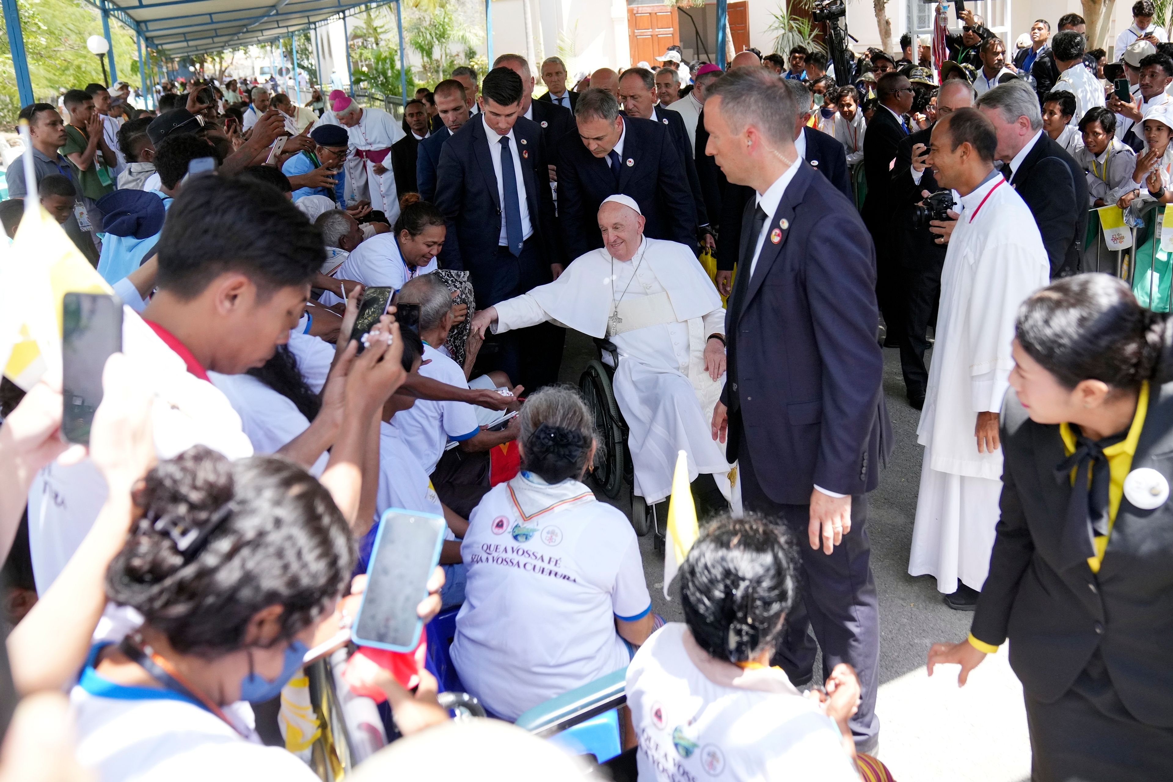 Pope Francis greets the people after the holy mass at the Cathedral of the Immaculate Conception in Dili, East Timor, Tuesday, Sept. 10, 2024. (AP Photo/Dita Alangkara)