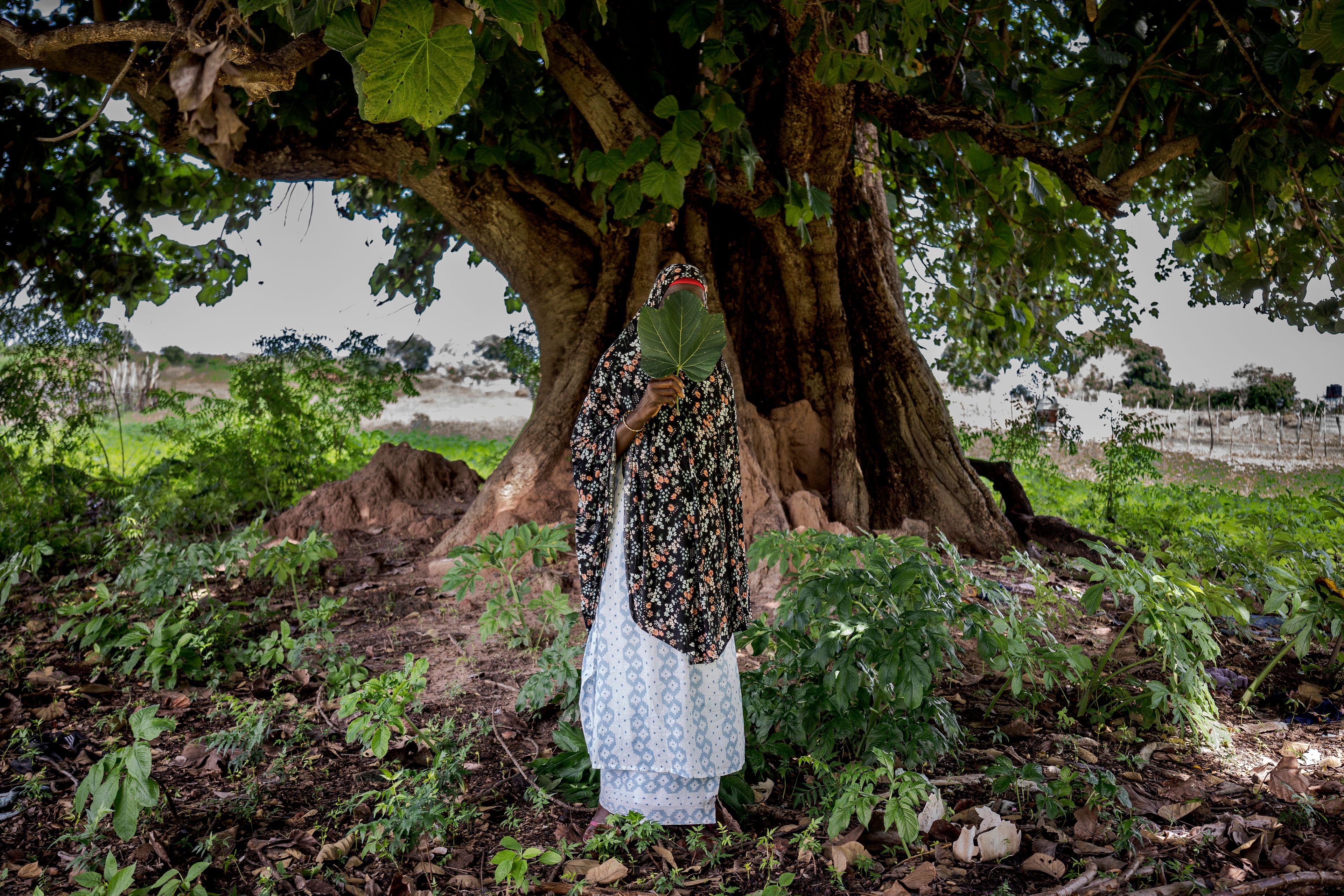 FILE - Fatoumatta,, a survivor of female genital mutilation, poses for a photograph in the village of Sintet, Gambia, Friday, July. 26, 2024. (AP Photo/Annika Hammerschlag, File)