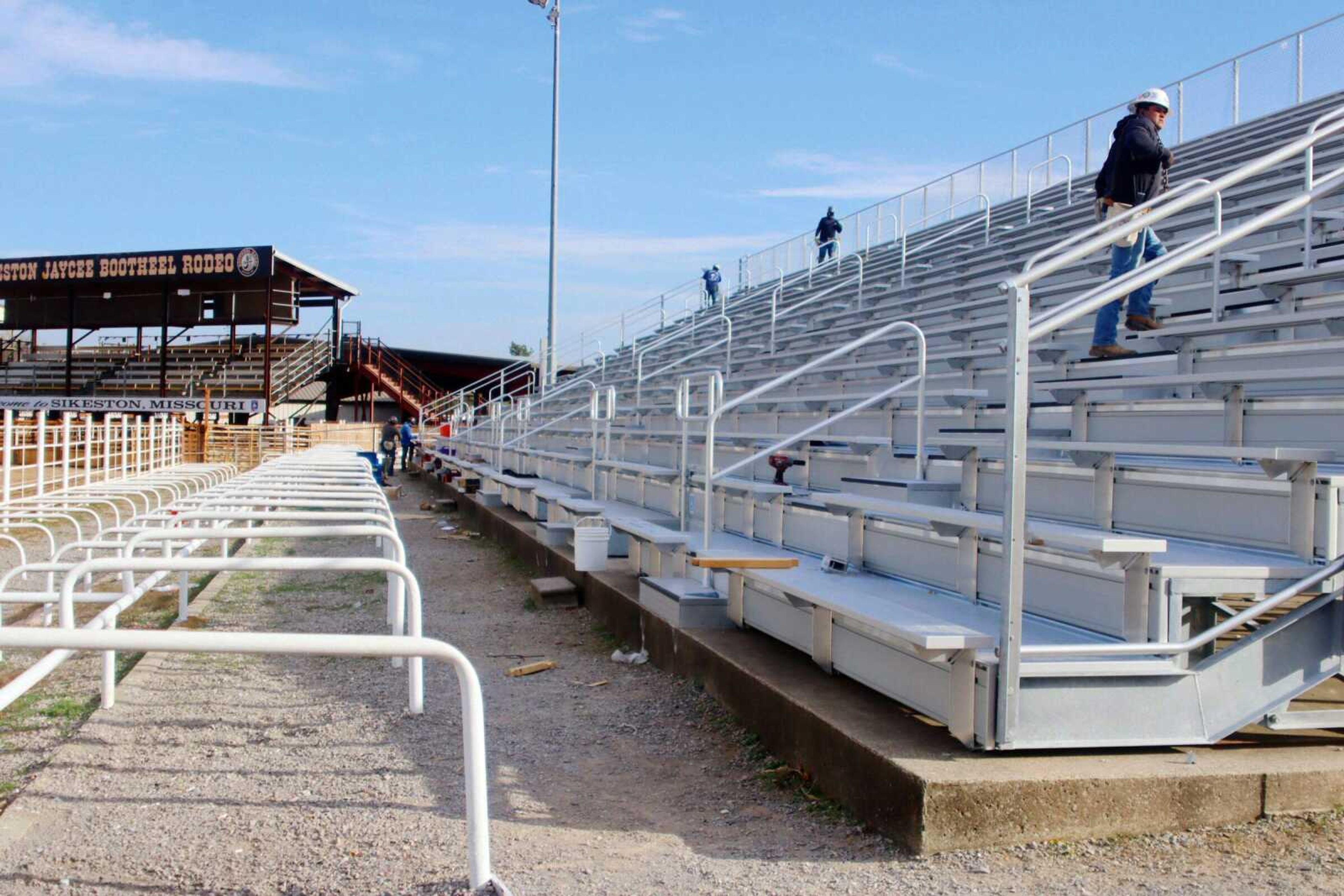 Construction workers work on the new bleachers at the Sikeston Jaycee Bootheel Rodeo grounds on Wednesday afternoon, Oct. 18, in Sikeston, Missouri. The Sikeston Jaycee Bootheel Rodeo is installing a new set of aluminum bleachers. The new bleachers are by Southern Bleacher Co. Inc of Frisco, Texas. The bleachers are scheduled to be finished by the spring of 2024.