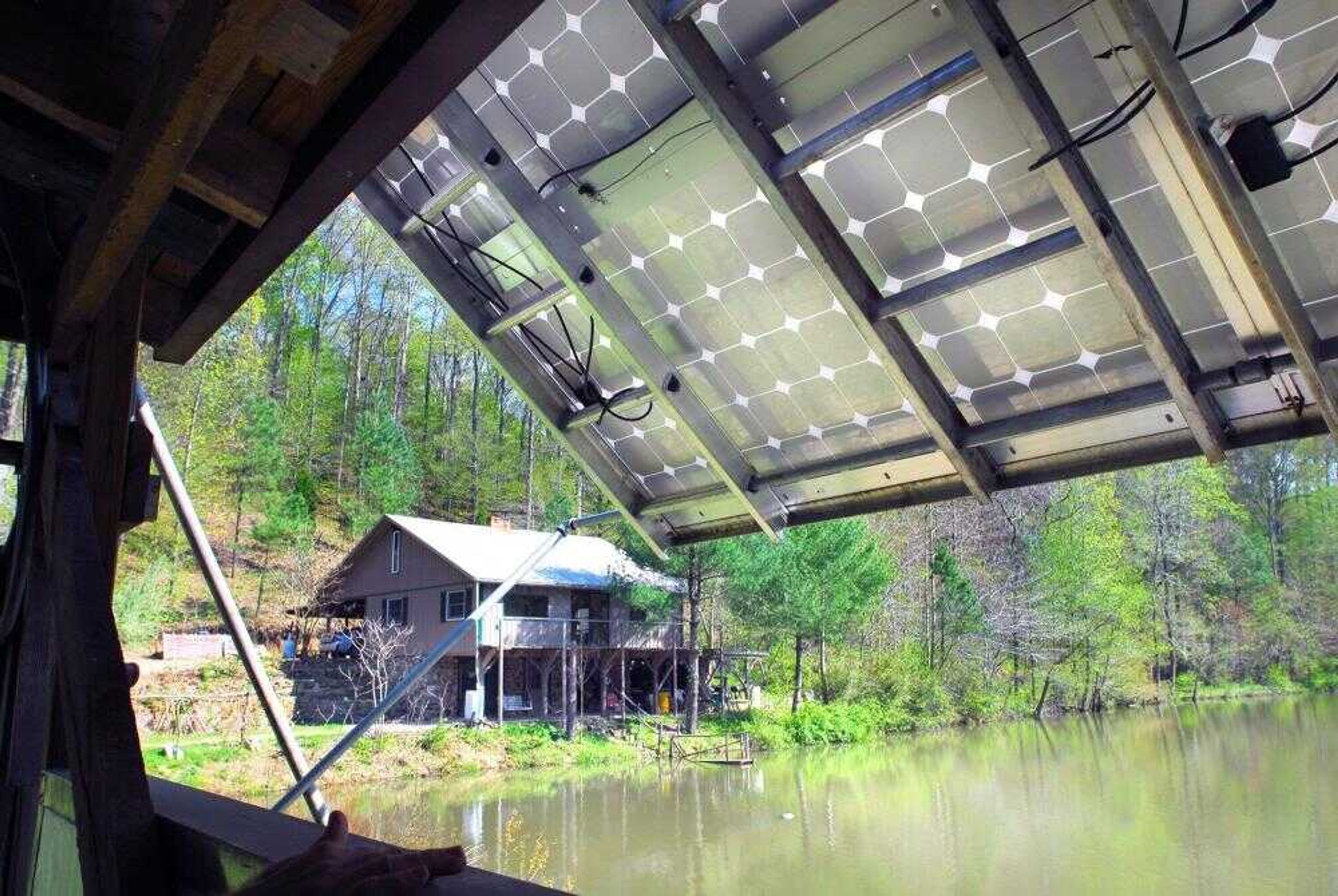 Jim and Mary Maginel's home is powered by solar panels that are set up beside the lake in front of their home.