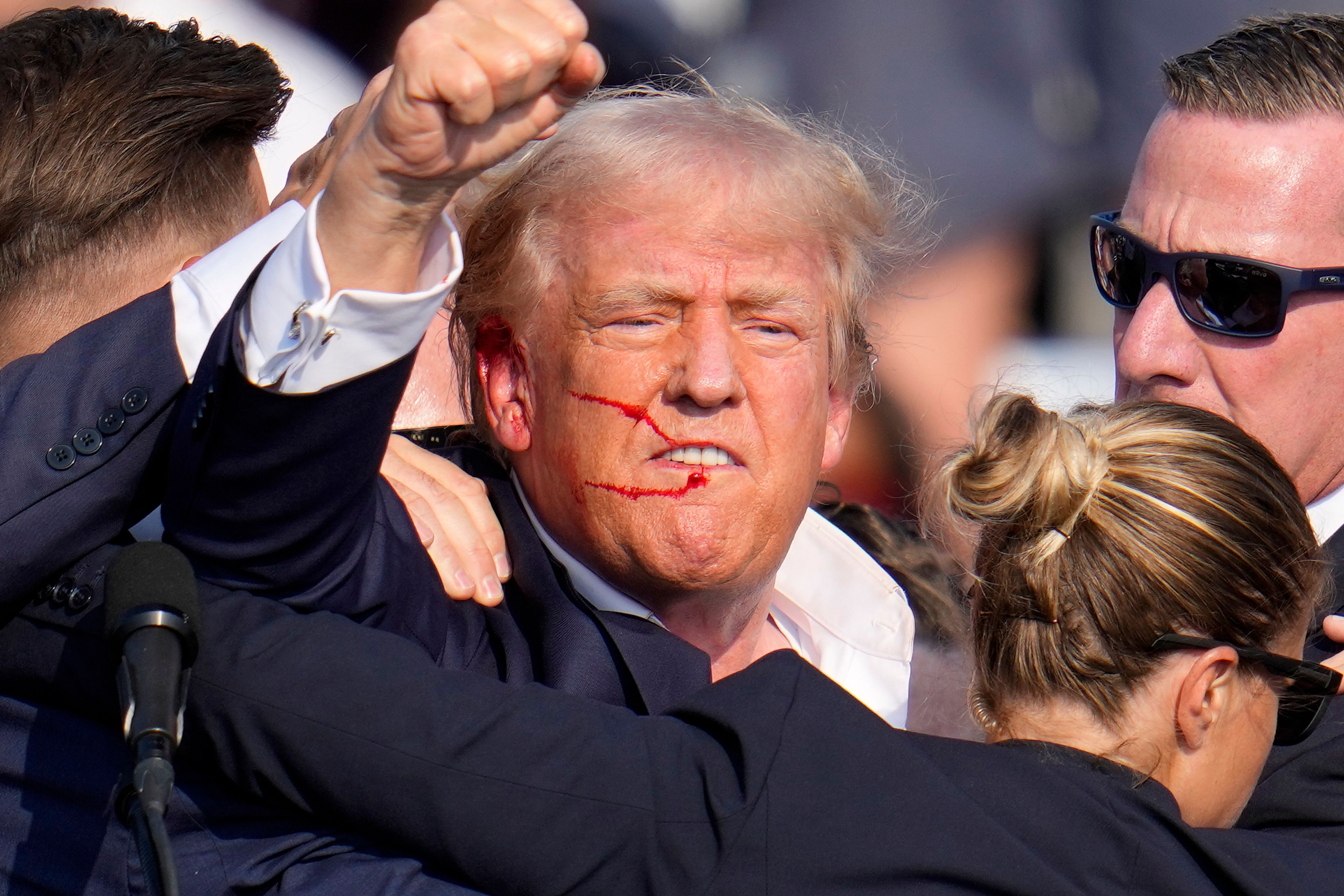 FILE - Republican presidential candidate former President Donald Trump reacts following an assassination attempt at a campaign event in Butler, Pa., July 13, 2024. (AP Photo/Gene J. Puskar, File)