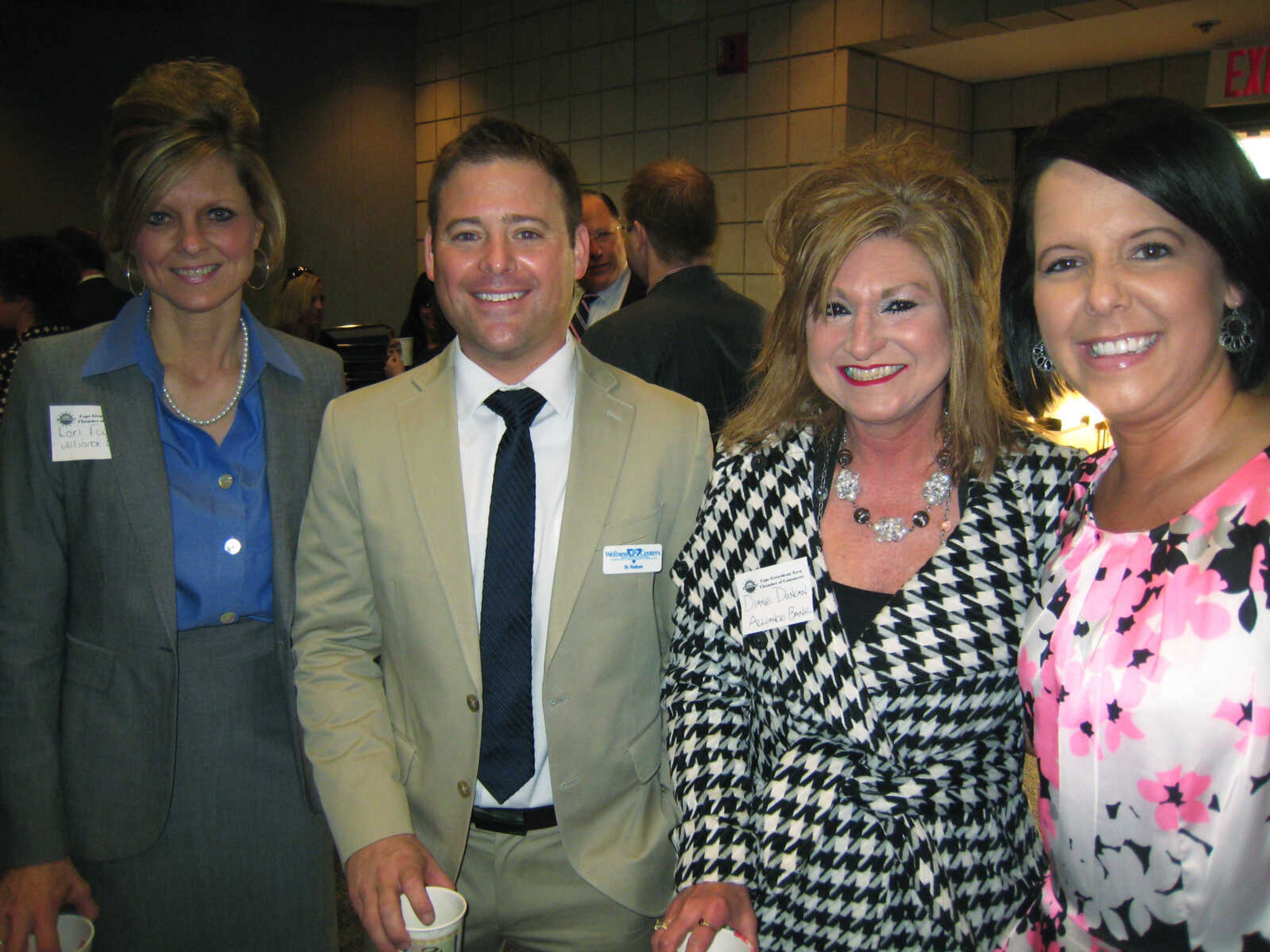 Lori Fowler, left, Alliance Bank; Dr. Seth Hudson, PC Wellness Centers; Diane Duncan, Alliance Bank; and Shelly Kaiser, Alliance Bank, pose at the Cape Girardeau Area Chamber of Commerce First Friday Coffee, April 5 at the Show Me Center.