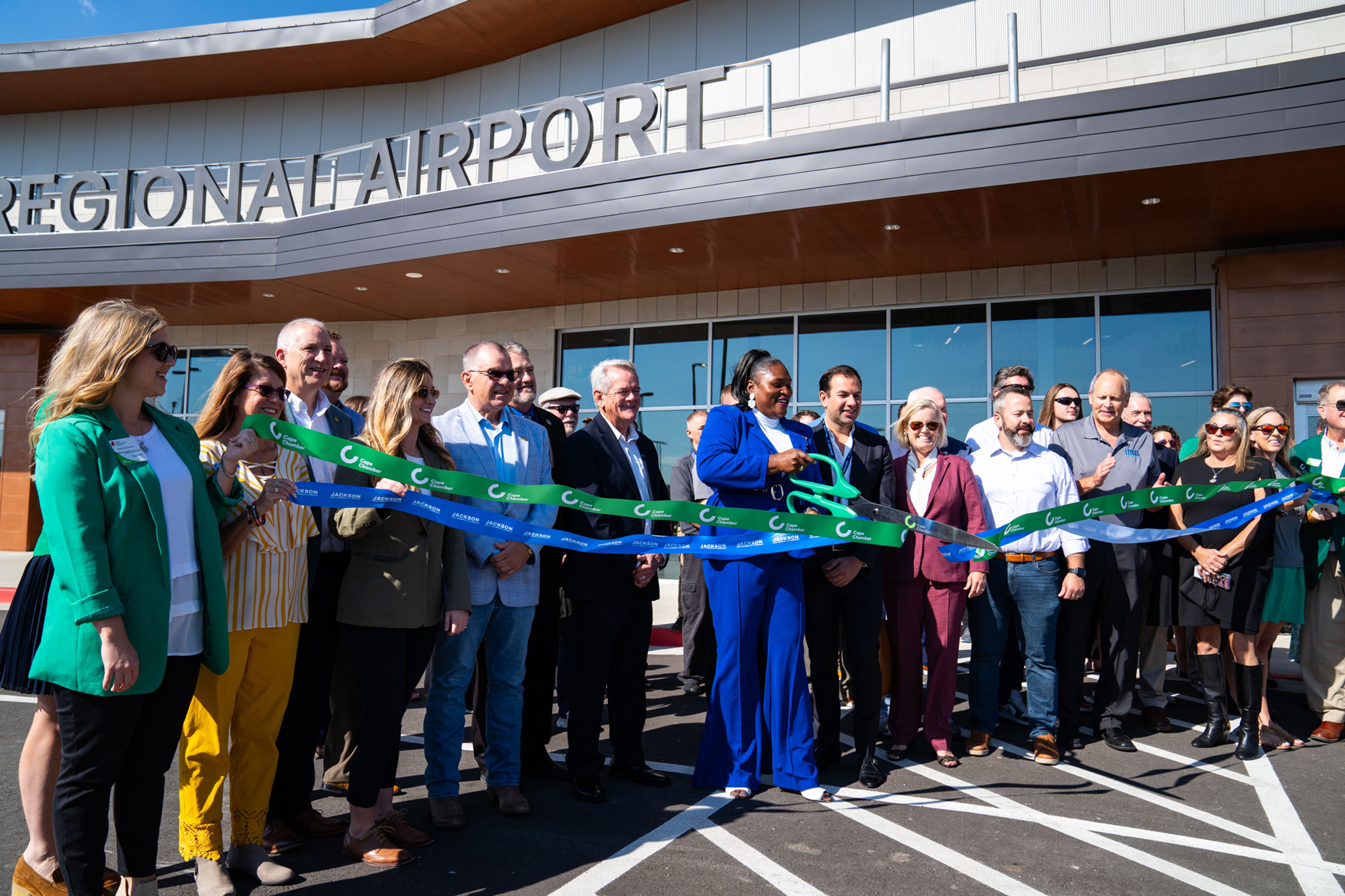 City and state officials join together to cut the ribbon on the new Cape Girardeau Regional Airport terminal on Tuesday, Oct. 1. The officials include Representative Jamie Burger, Representative John Voss, Airport manager JoJo Stewart, Airport advisory board member Bruce Loy, former airport manager  Katrina Amos, Contour Airlines CEO Matt Chaifetz, Mayor Stacy Kinder, Councilman Nate Thomas and  Airport advisory board chairman Richard Knote.