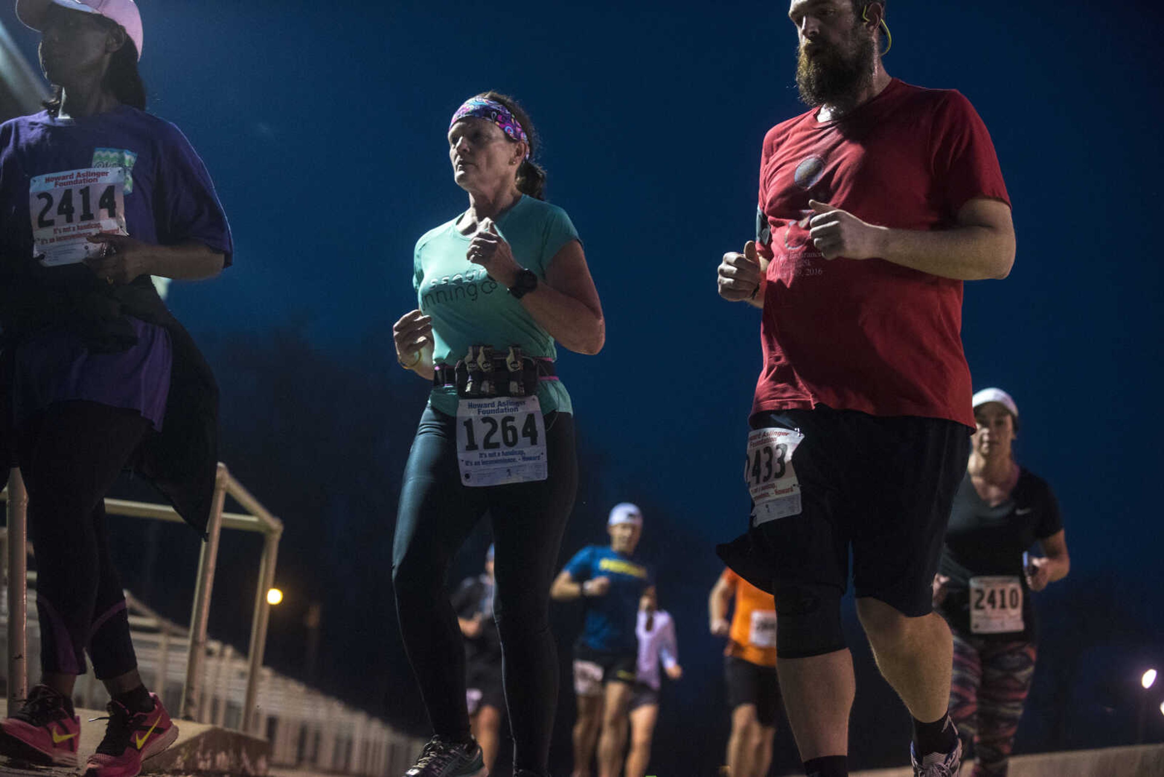 Participants make their way around the 1-mile loop set up at Arena Park for the 8th annual Howard Aslinger Endurance Run on Friday, March 17, 2017 in Cape Girardeau. The event raises money for the Howard L. Aslinger Memorial Scholarship where runners will keep running until they can't anymore with the event starting at 7 p.m. Friday night going for 24 hours until Saturday night.