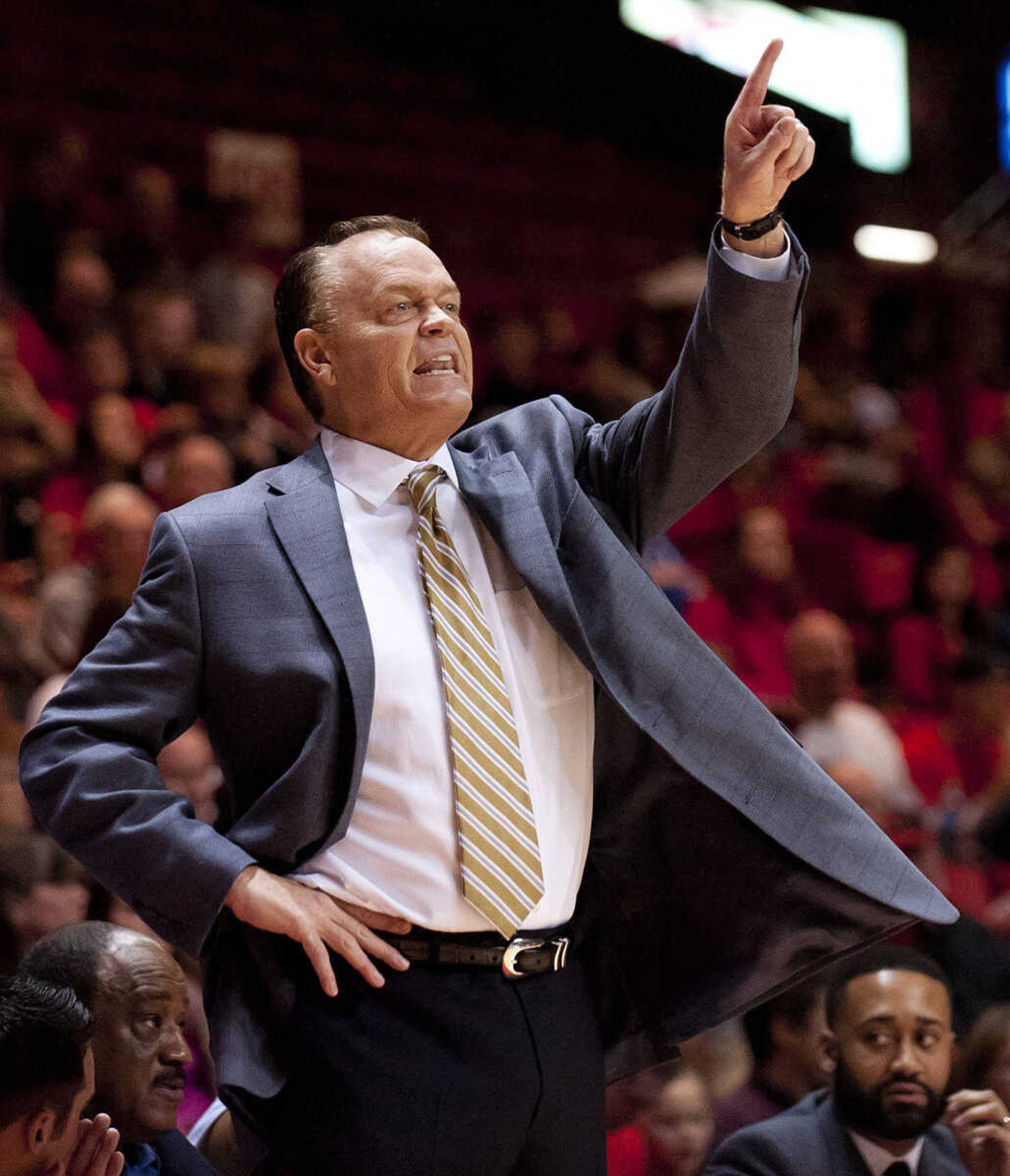 Southeast Missouri State coach Dickey Nutt gives instructions to his players in the second half of the Redhawks' 107-94 loss to the Belmont Bruins Thursday, Jan. 9, at the Show Me Center.