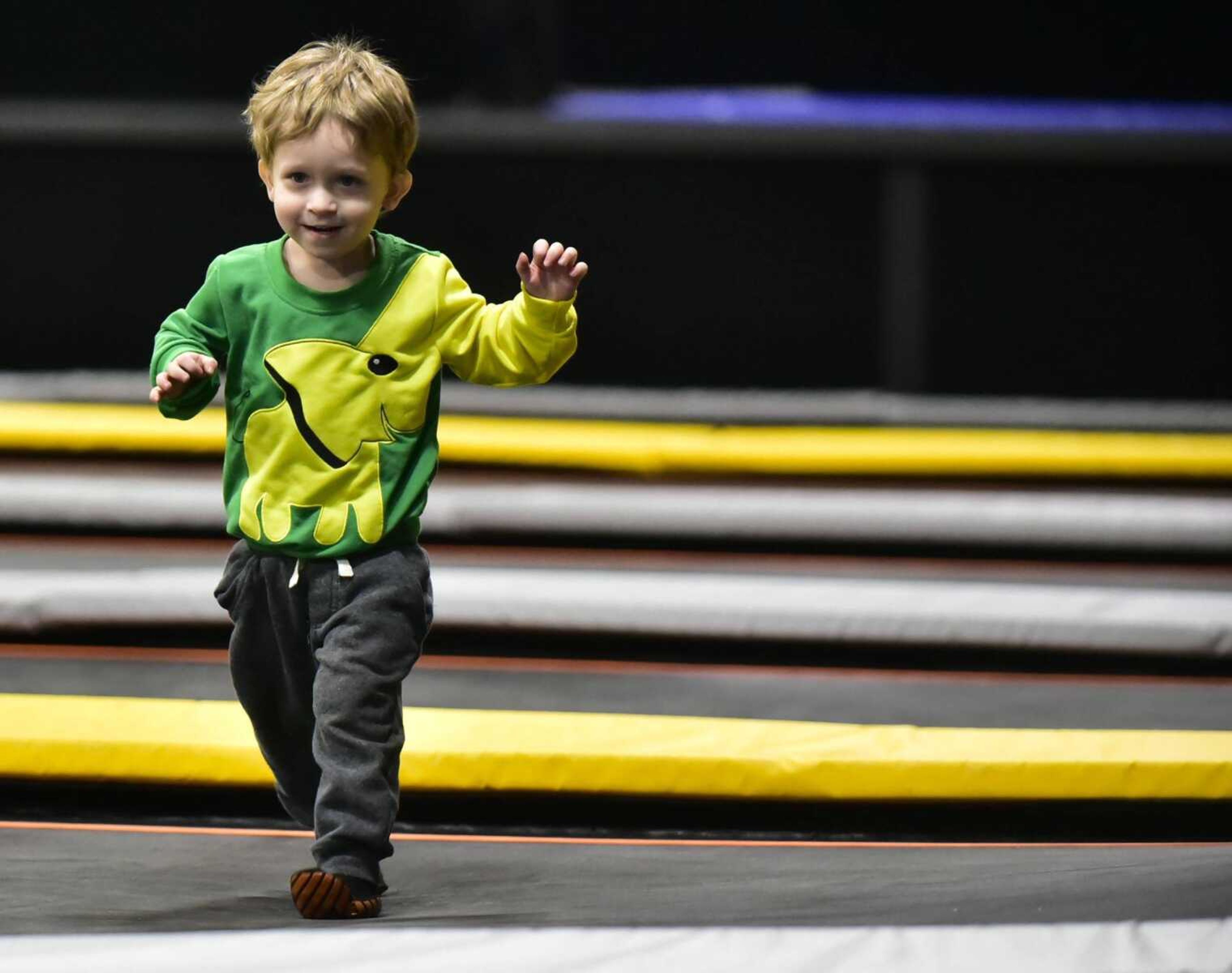 Jayse Revelle, 2, runs across a group of trampolines  during an Easterseals Midwest monthly outing Tuesday, Feb. 13, 2018, at Ultimate Air Trampoline Park in Scott City.