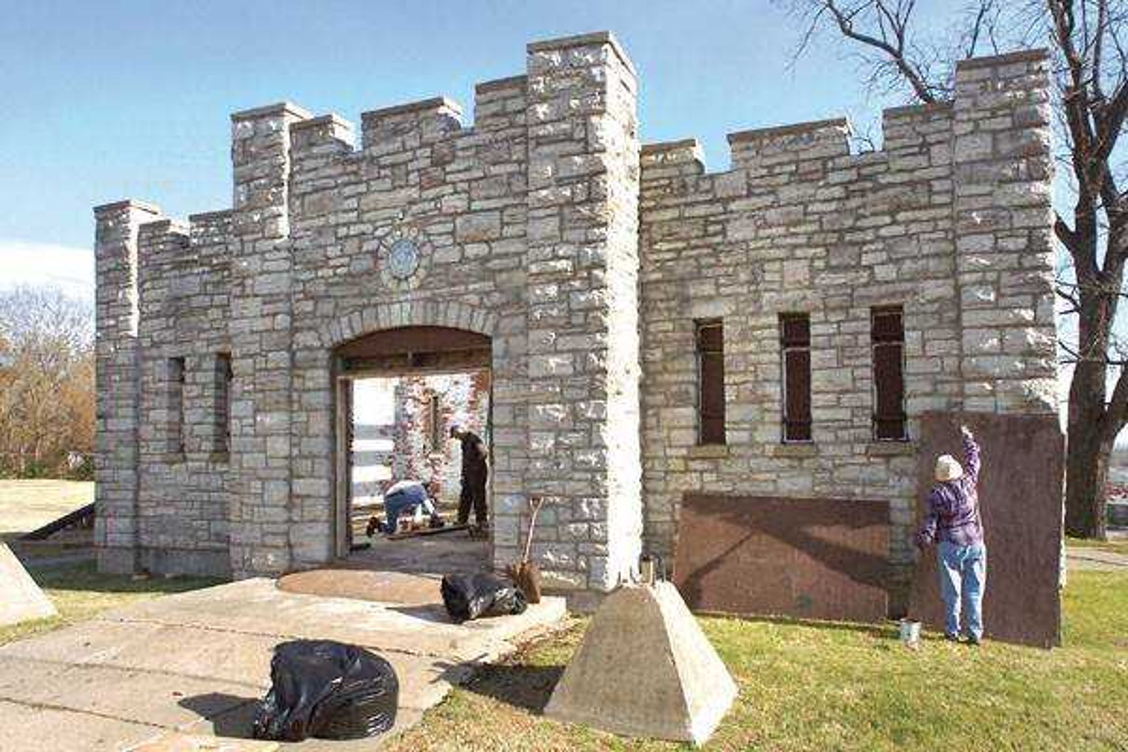 Members of the Civil War Round Table worked on repairing the stone building at Fort D on Saturday. (Fred Lynch)