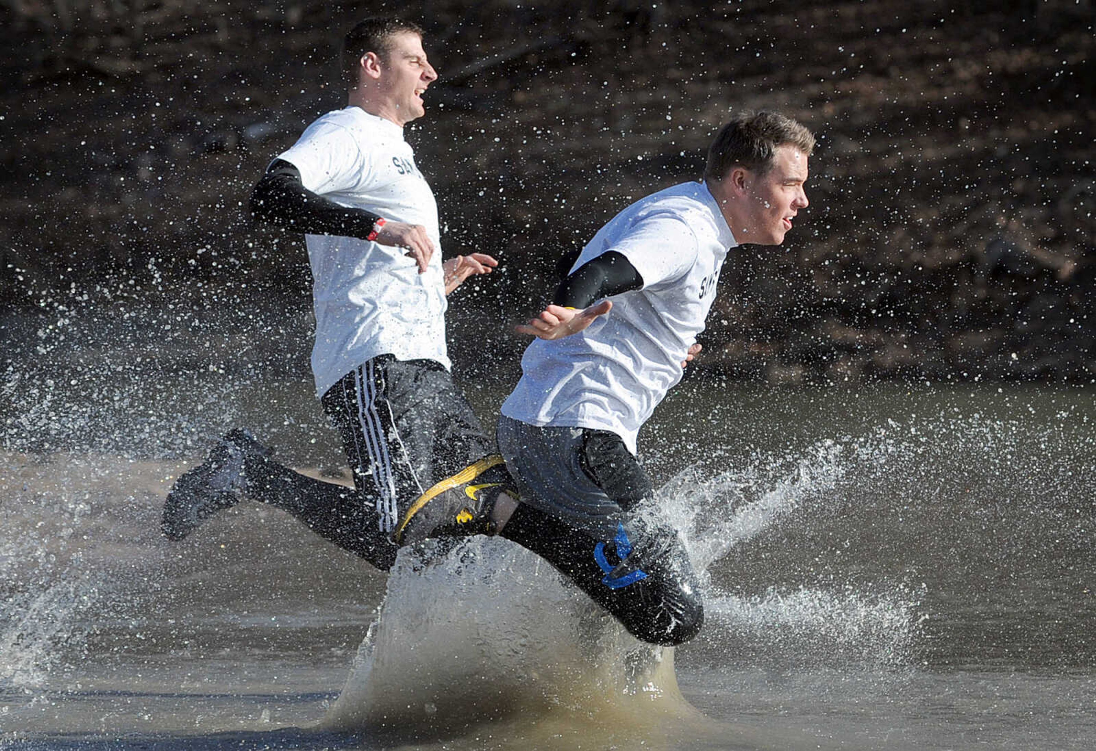 LAURA SIMON ~ lsimon@semissourian.com
People plunge into the cold waters of Lake Boutin Saturday afternoon, Feb. 2, 2013 during the Polar Plunge at Trail of Tears State Park. Thirty-six teams totaling 291 people took the annual plunge that benefits Special Olympics Missouri.