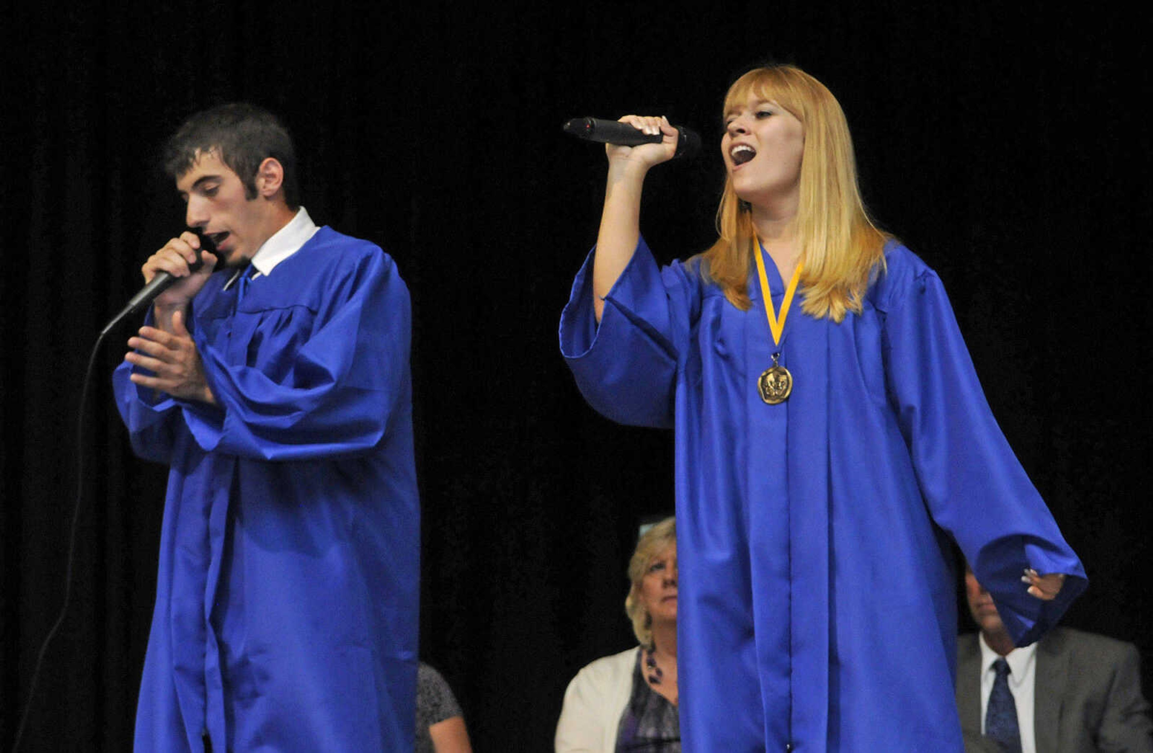 KRISTIN EBERTS ~ keberts@semissourian.com

Brandon DeProw and Kristen Keesee sing during Scott City High School's 2010 Commencement in the school gym on Sunday, May 23.