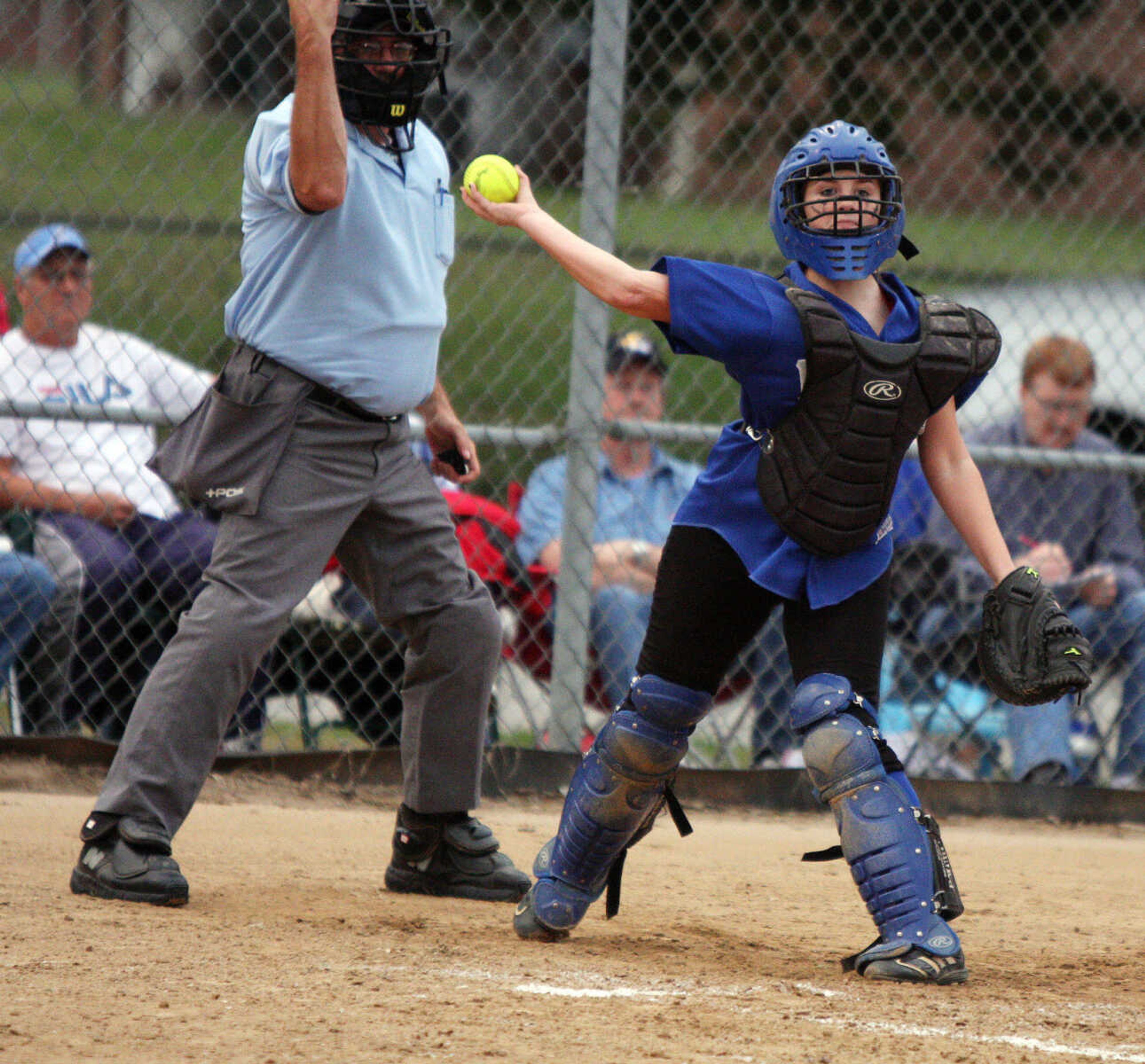 Delta's Samantha Bartels attempts to throw out a runner at first during their game against Neelyville.