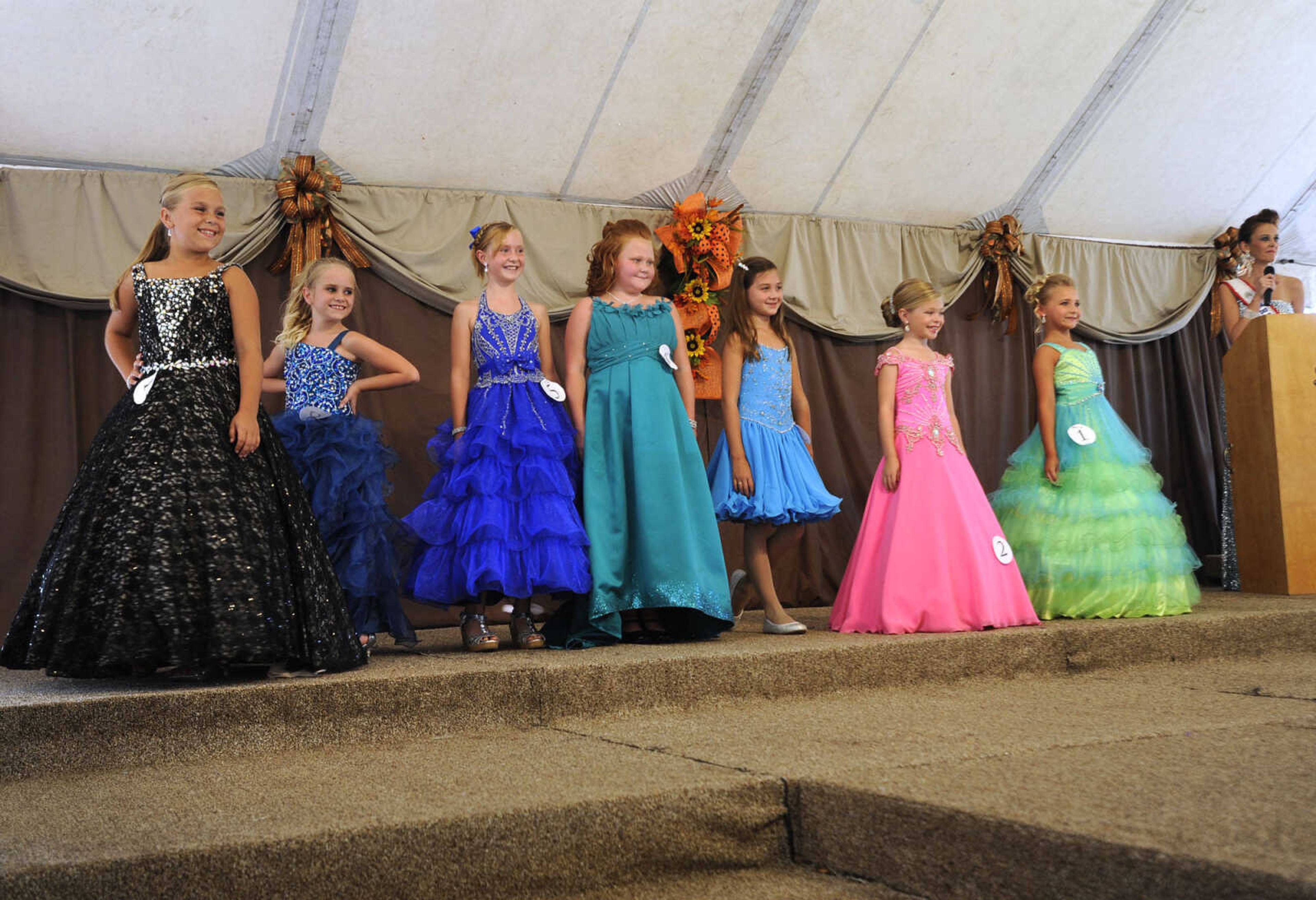 Young Miss SEMO Fair contestants, ages 7-9, pose for the judges Sunday, Sept. 7, 2014 at the SEMO District Fair.