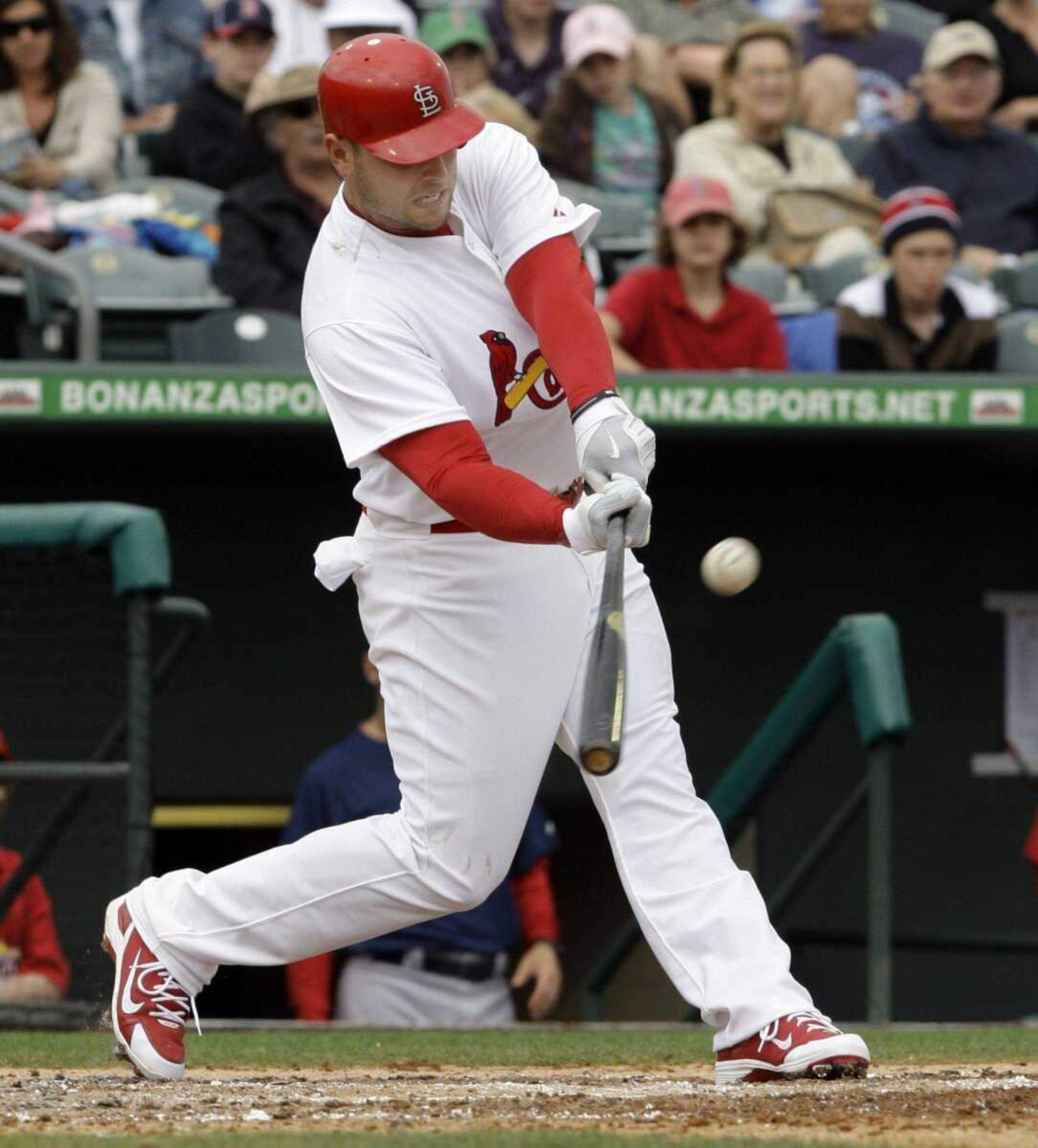 Cardinals designated hitter Matt Holliday doubles in a run during the third inning of St. Louis' spring training game Monday against the Red Sox in Jupiter, Fla. St. Louis won the split-squad game 13-8. (RICHARD DREW ~ Associated Press)