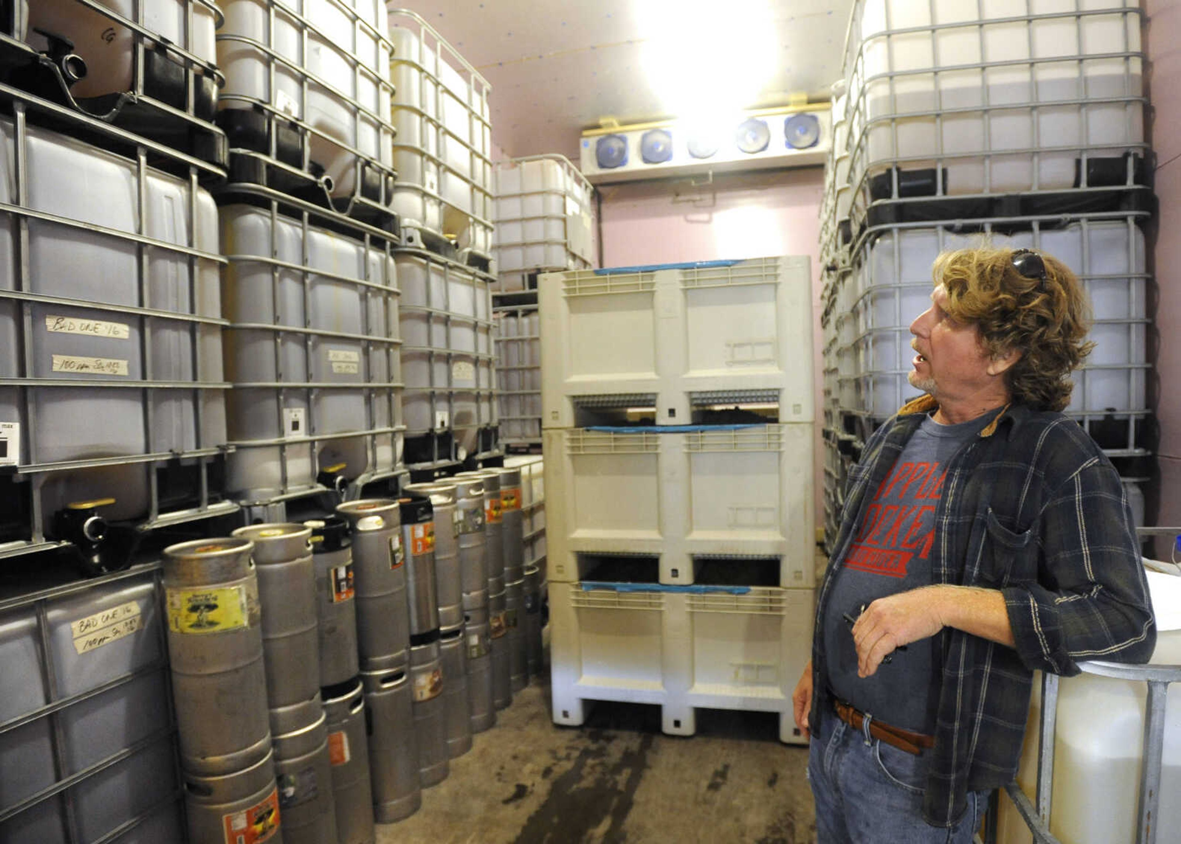 FRED LYNCH ~ flynch@semissourian.com
Brad Genung shows the cold room where juices boxes holding fermented hard cider, at left, are stored at a temperature of 32 degrees at Owl Creek Vineyard.