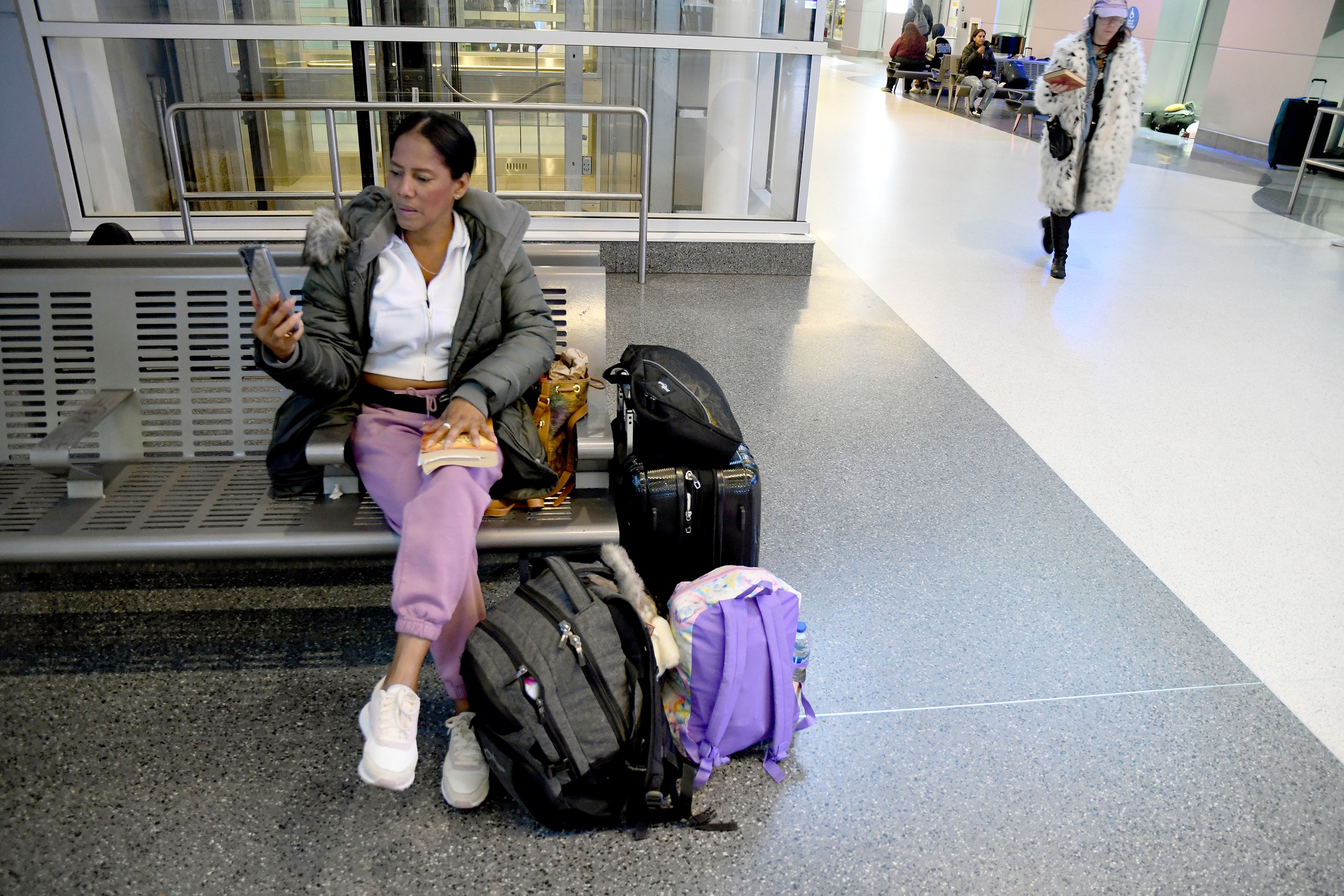 Sofia Roca, an immigrant from Colombia, prepares to leave Aurora, Colorado, on March 29, 2024. (AP Photo/Thomas Peipert)