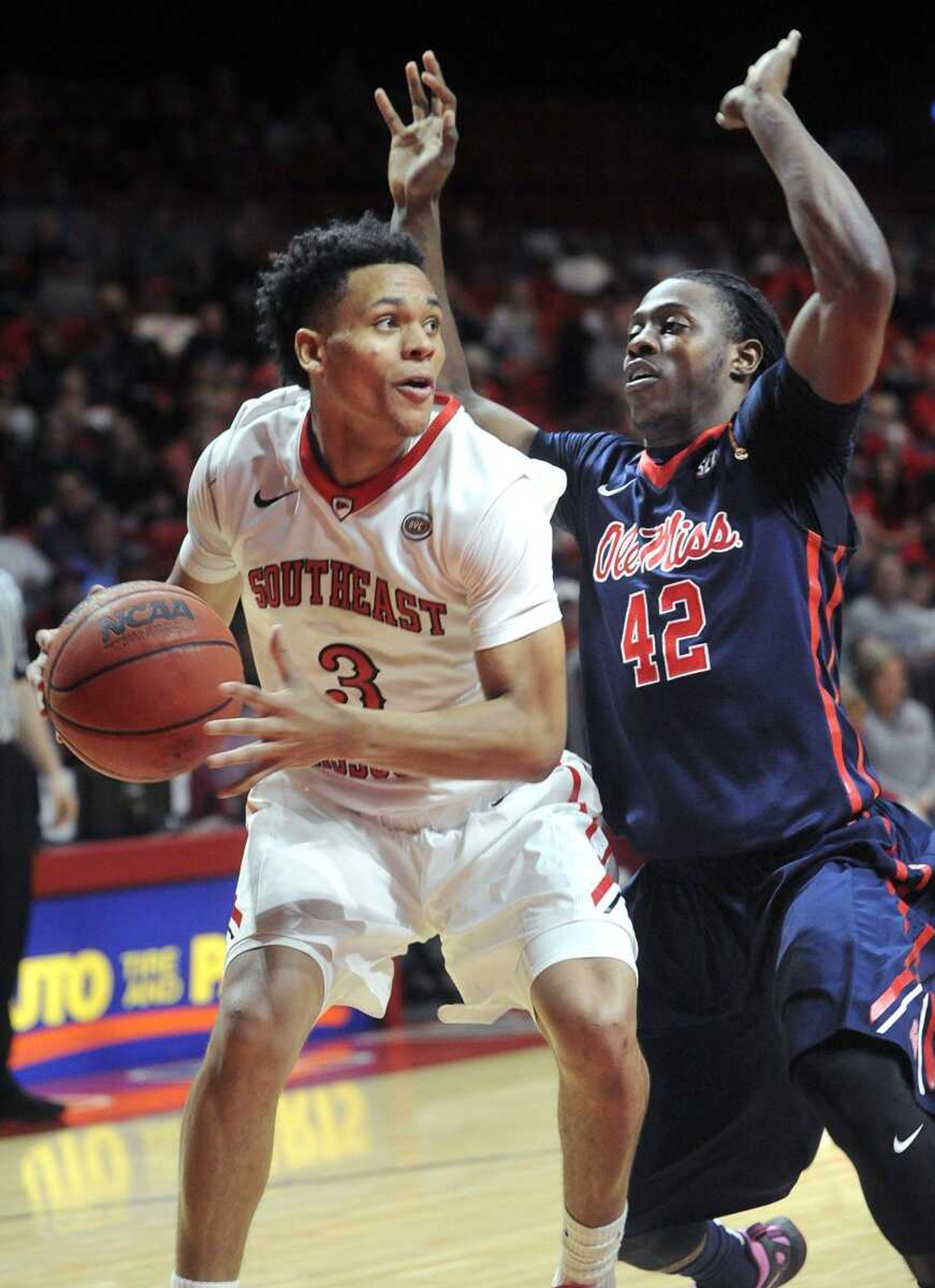 Southeast Missouri State's Eric McGill drives against Ole Miss' Stefan Moody during the first half Saturday at the Show Me Center. (Fred Lynch)