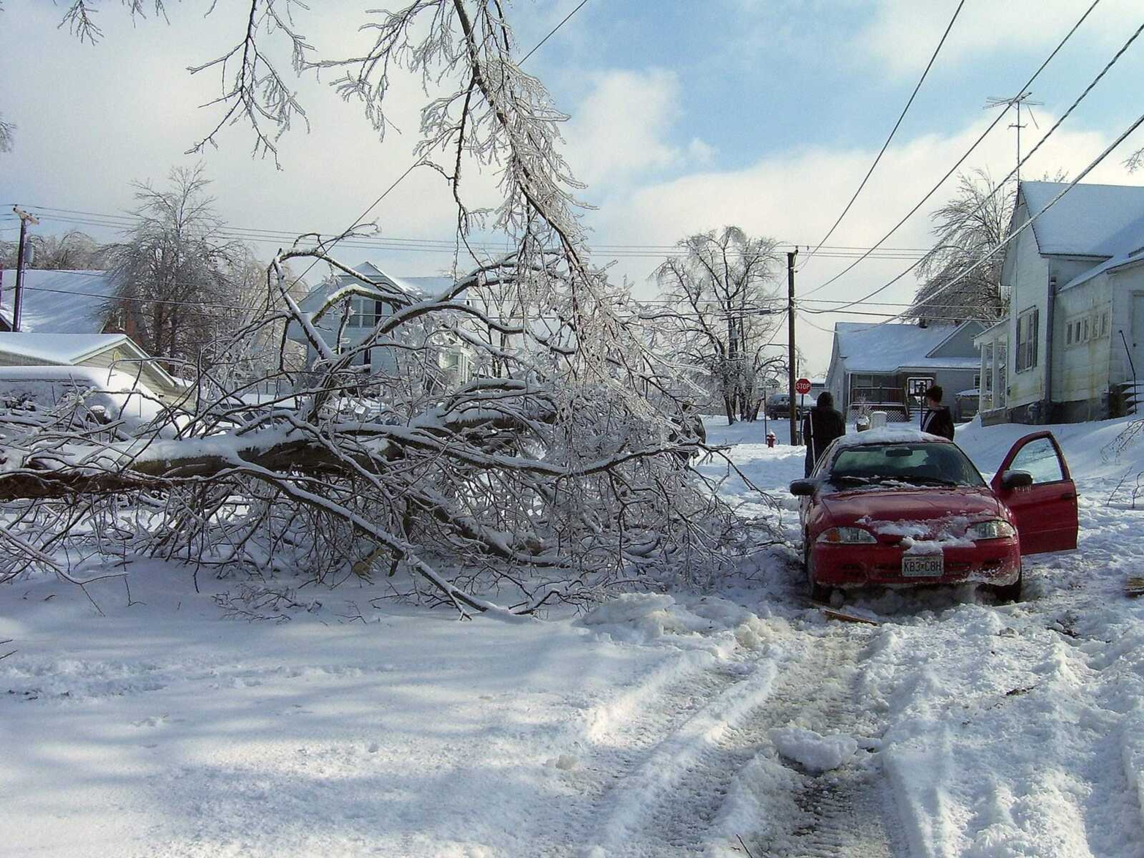 MATT SANDERS ~ msanders@semissourian.com
A car is stuck on Cherry Street in the Old Illmo section of Scott City after trying to pass by a downed tree.