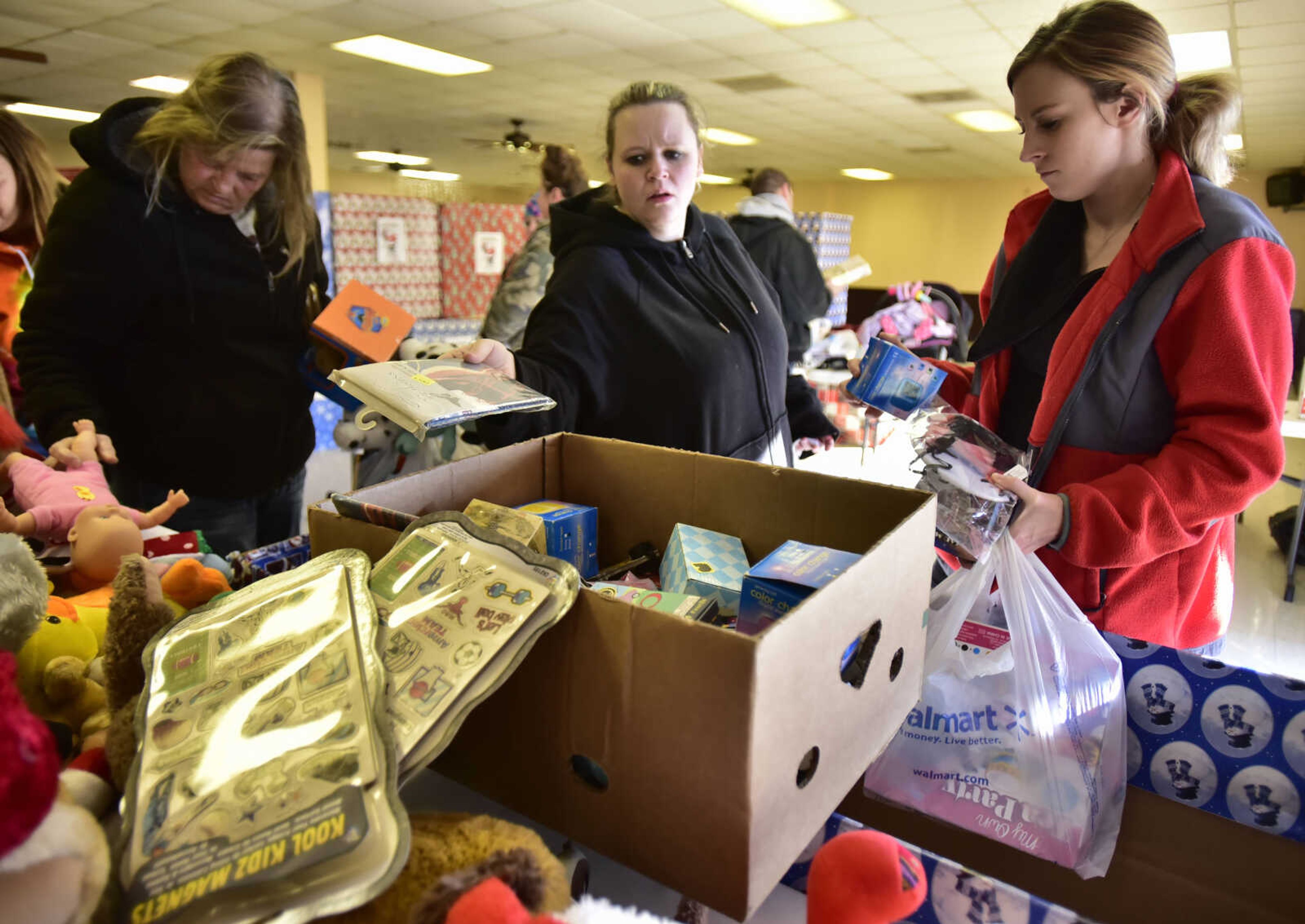 Local parents choose gifts for their children Friday, Dec. 15, 2017, at Elks Lodge #2652 in Jackson