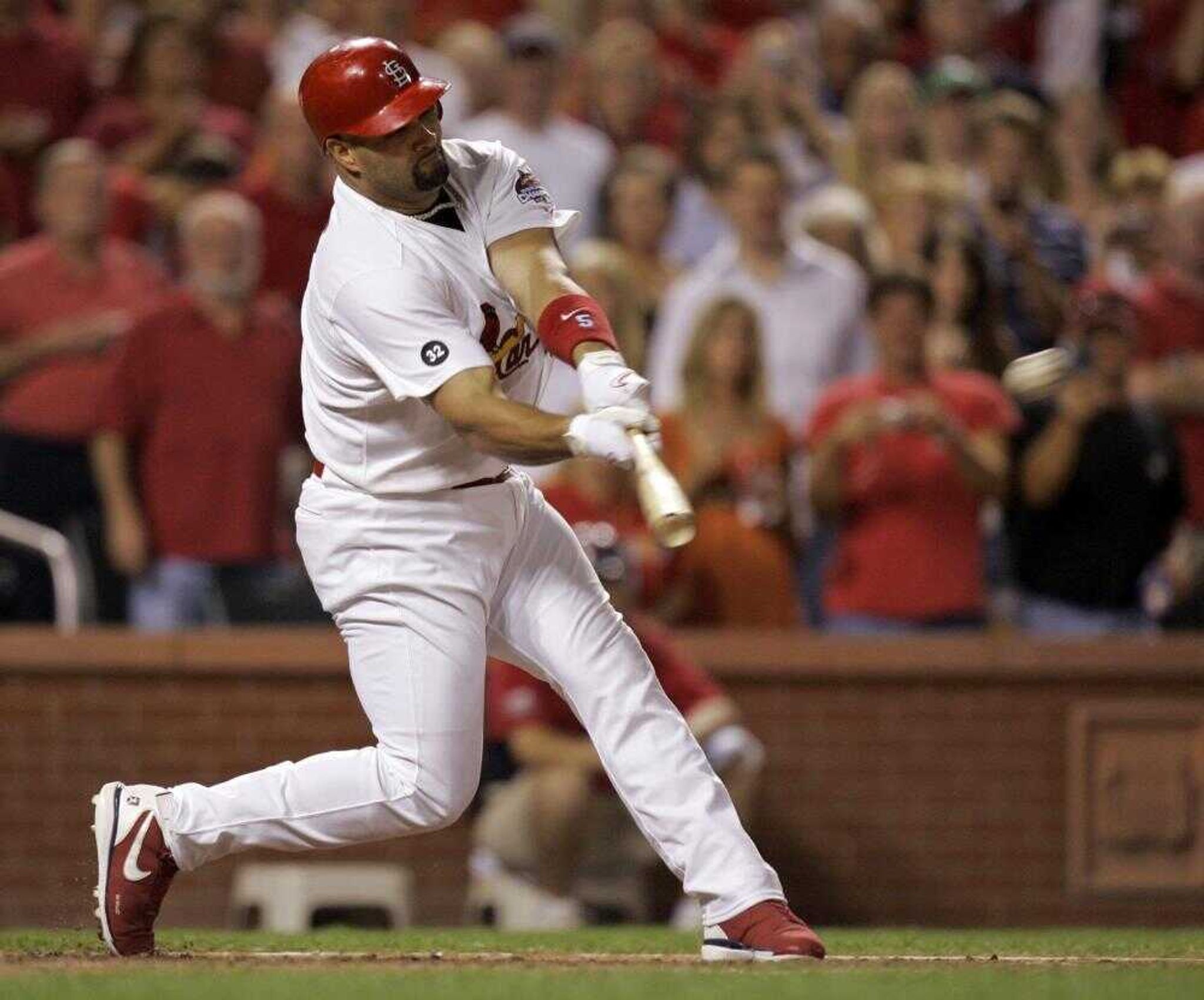 Cardinals slugger Albert Pujols singled home two runs during a pinch-hit appearance during Saturday's game against the Houston Astros. (JEFF ROBERSON ~ Associated Press)