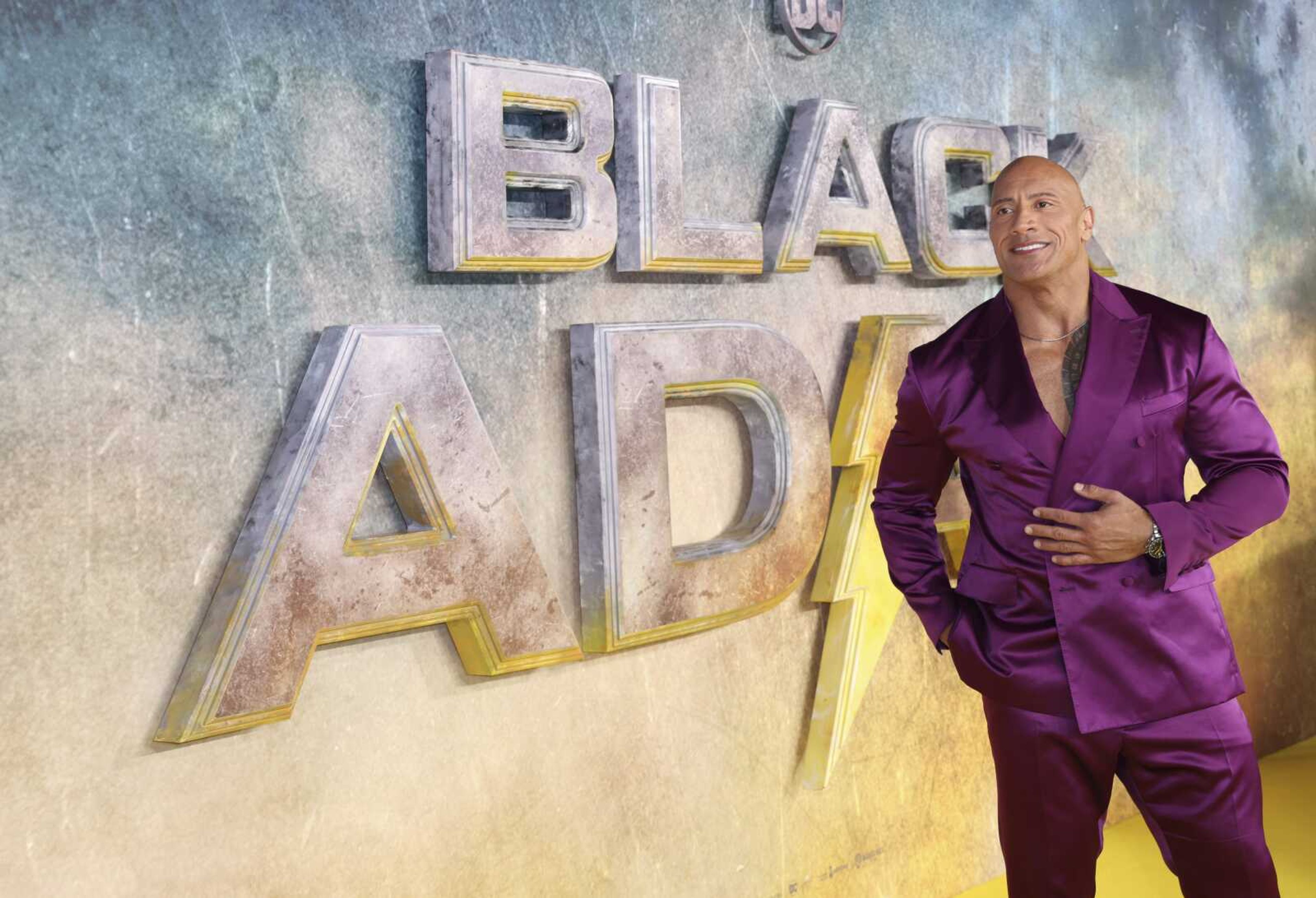 Dwayne Johnson poses for photographers upon arrival for the premiere of the film 'Black Adam' on Oct. 18 in London.