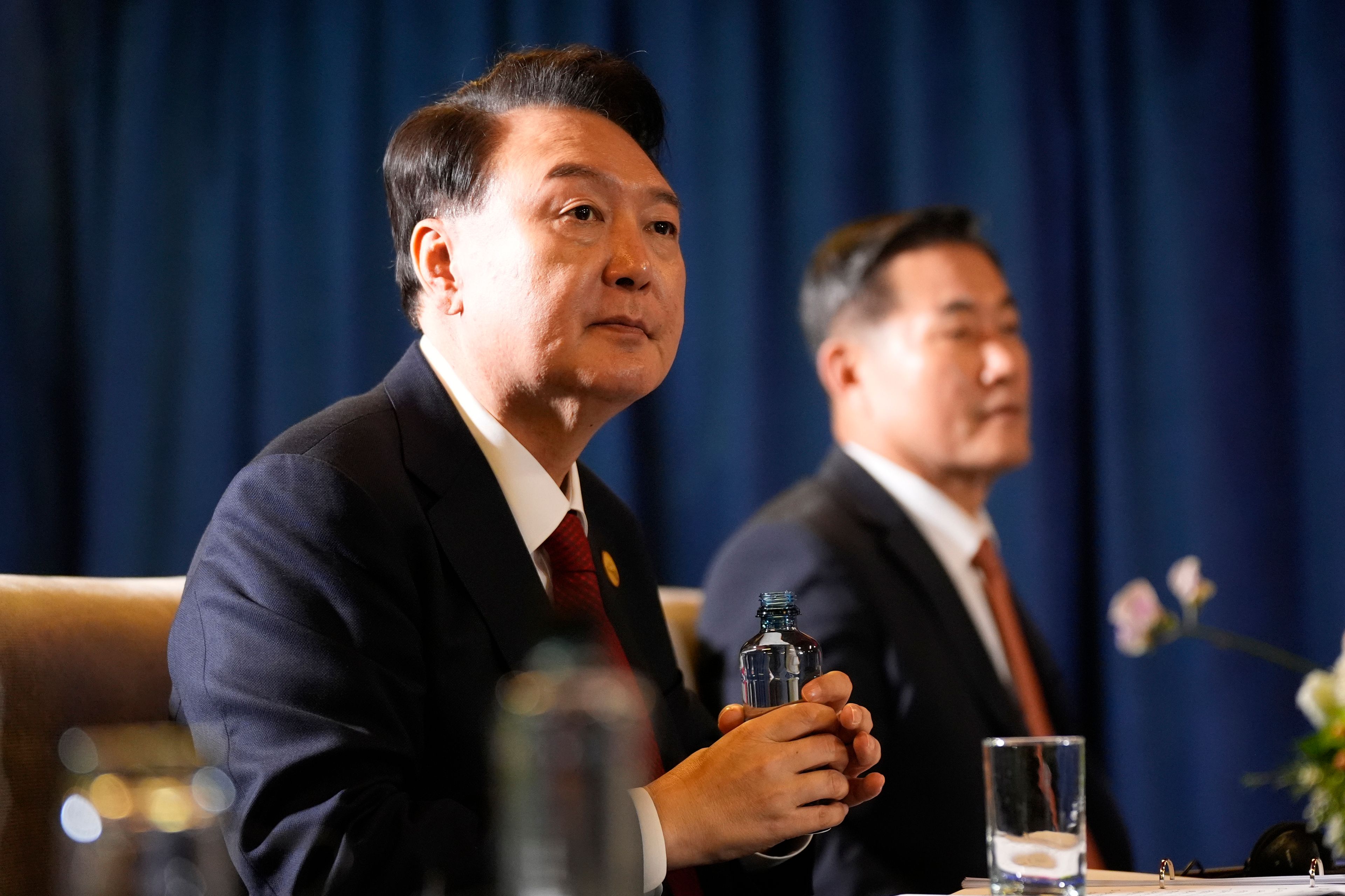 President of South Korea Yoon Suk Yeol listens during a trilateral meeting with President Joe Biden and the Prime Minister of Japan Shigeru Ishiba in Lima, Peru, Friday, Nov. 15, 2024. (AP Photo/Manuel Balce Ceneta)