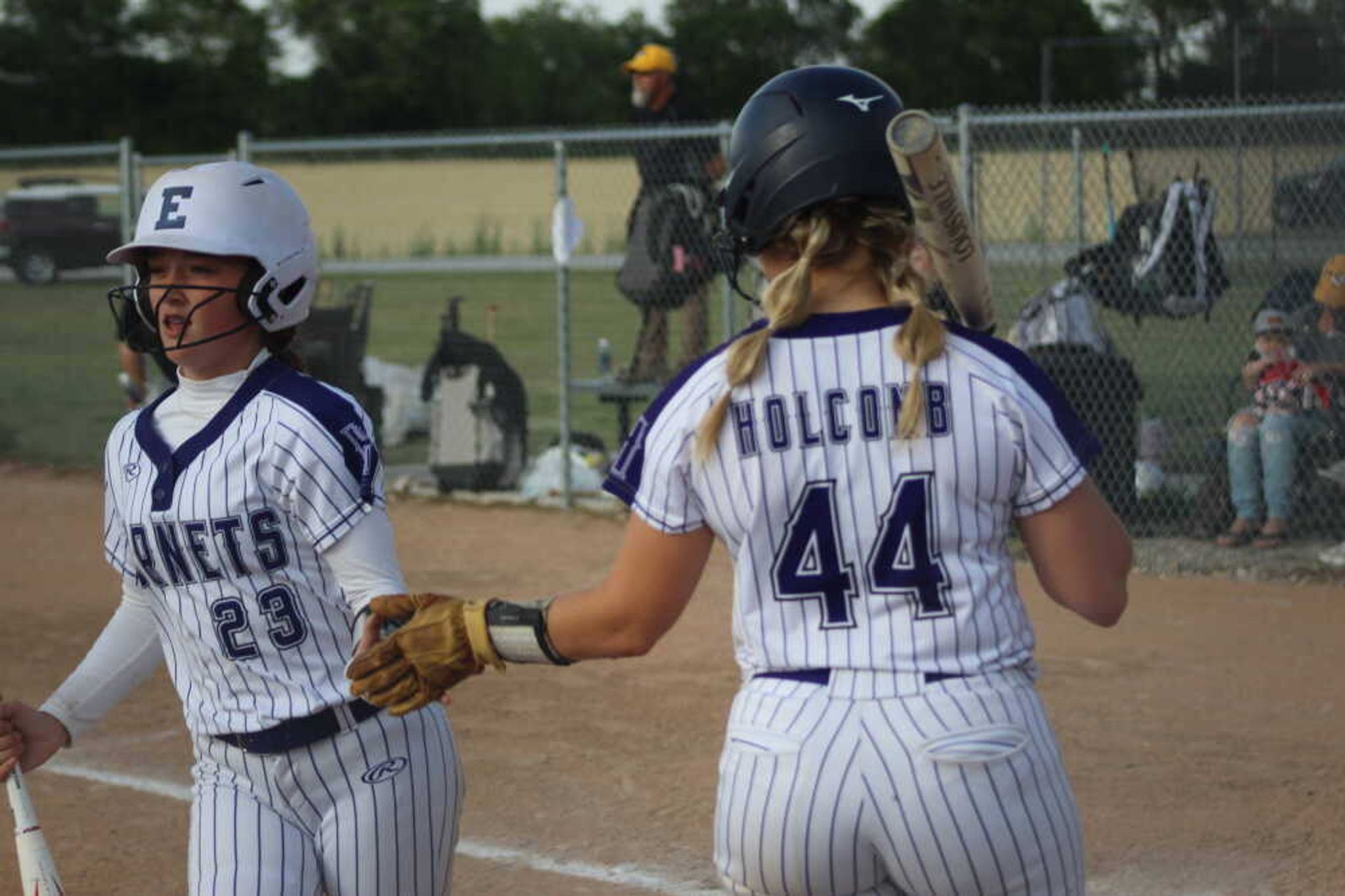 Home run hitter Addi Elliott collects some love from senior shortstop Maleigh Lemings Tuesday at the Tri-County Conference championship game at Clarkton.
