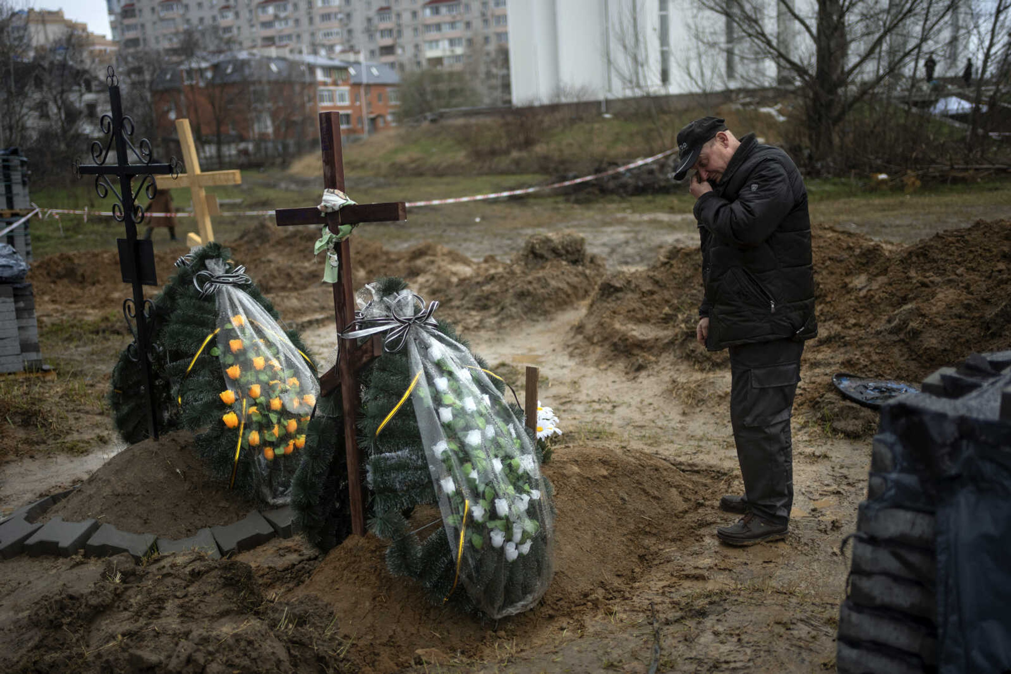 Oleg, 56, mourns for his mother Inna, 86, killed during the war against Russia, on Sunday in Bucha, in the outskirts of Kyiv, Ukraine.