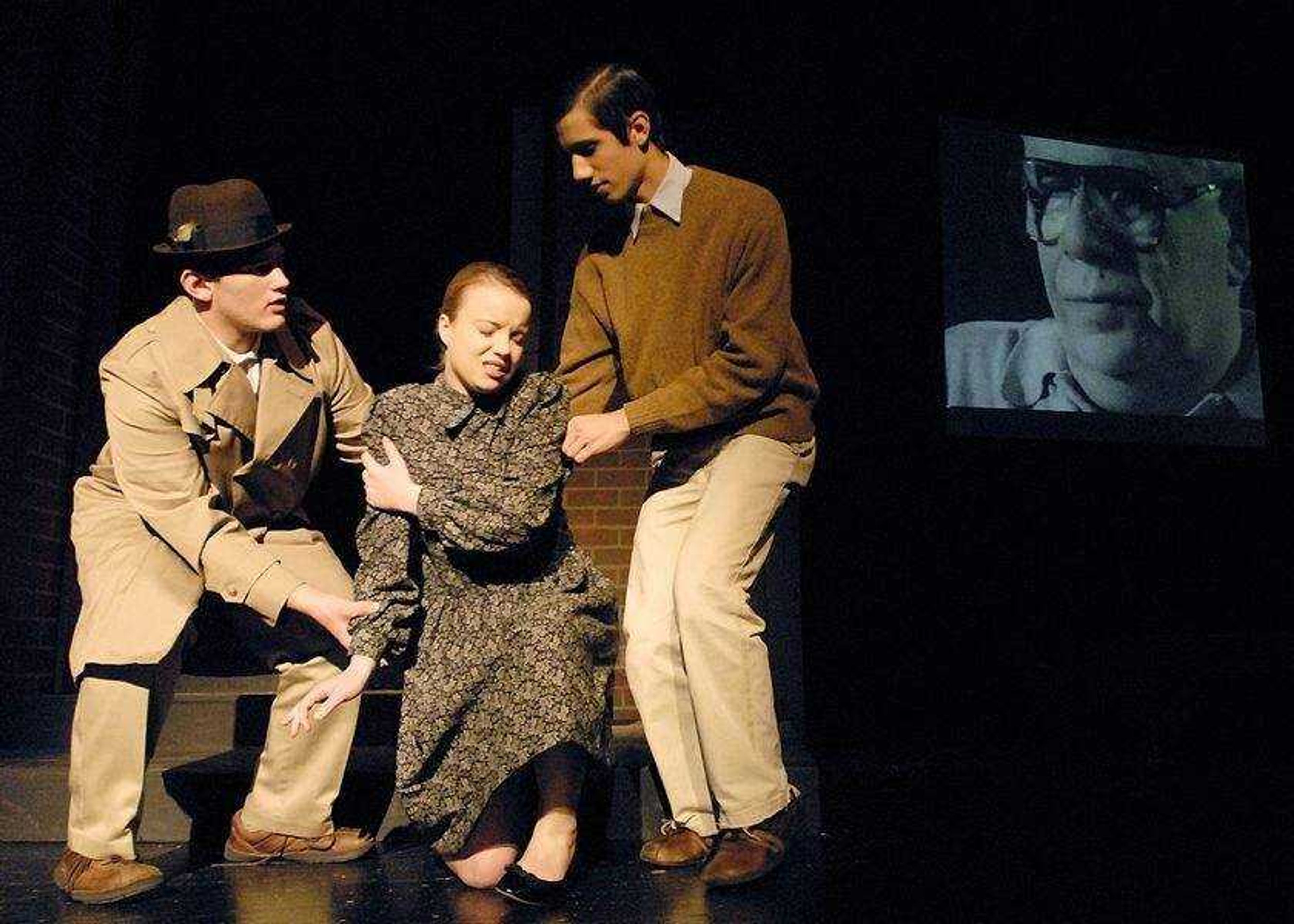 CHUCK WU ~ cwu@semissourian.com<br>Clayton Goodman left, Autumn Vandeven and Jared James pratices in a play called "And Then They Came for Me: Remembering the World of Anne Frank." It's a multimedia production which features close friends of Anne Frank speaking in the background, Ed Silverberg is seen on the right. The play is produced by students and teachers at Notre Dame High school.