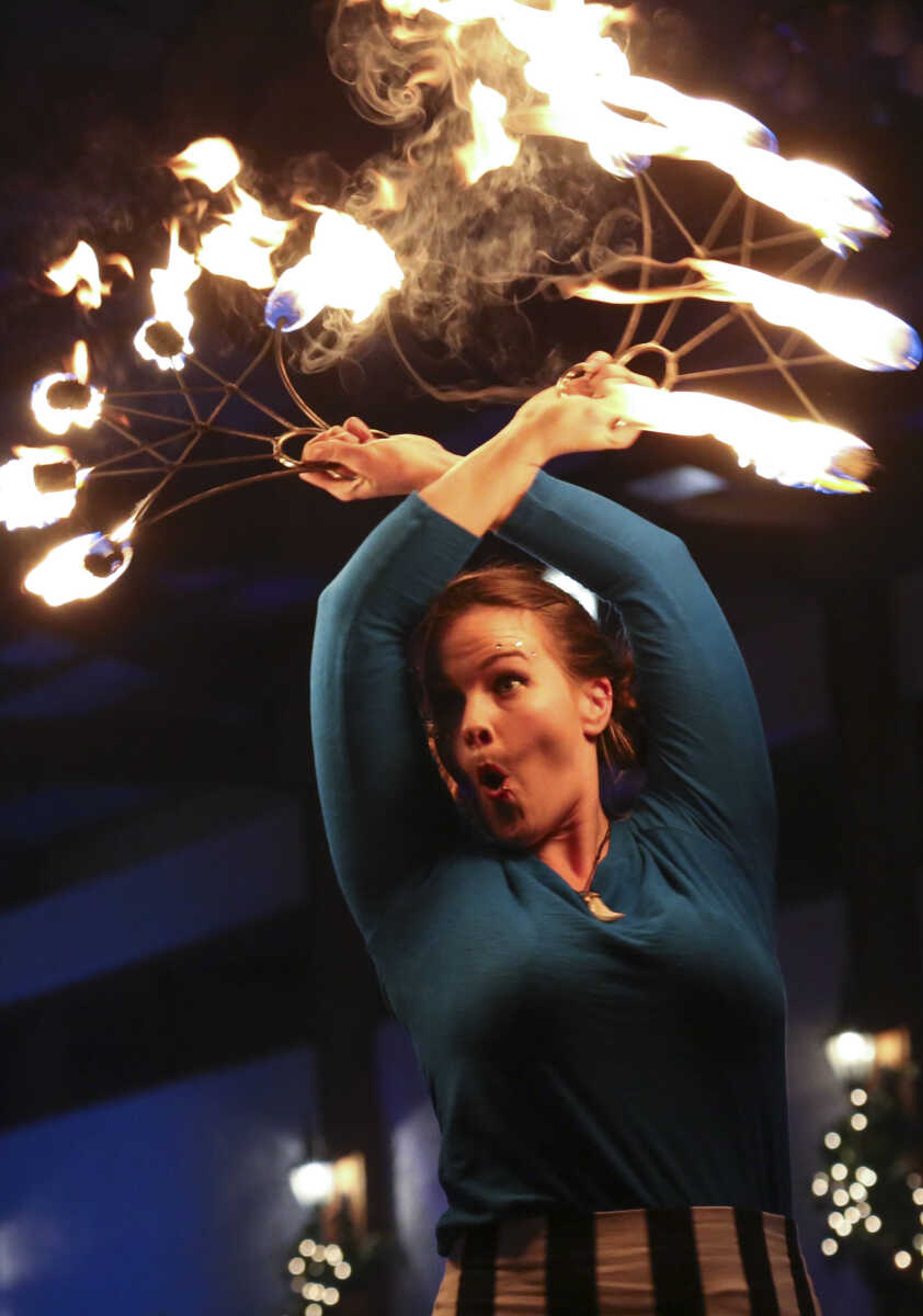 Honora Kinsella dances with fire Saturday, Feb. 3, 2018, during the Fire and Ice Gala at Bavarian Halle in Jackson.