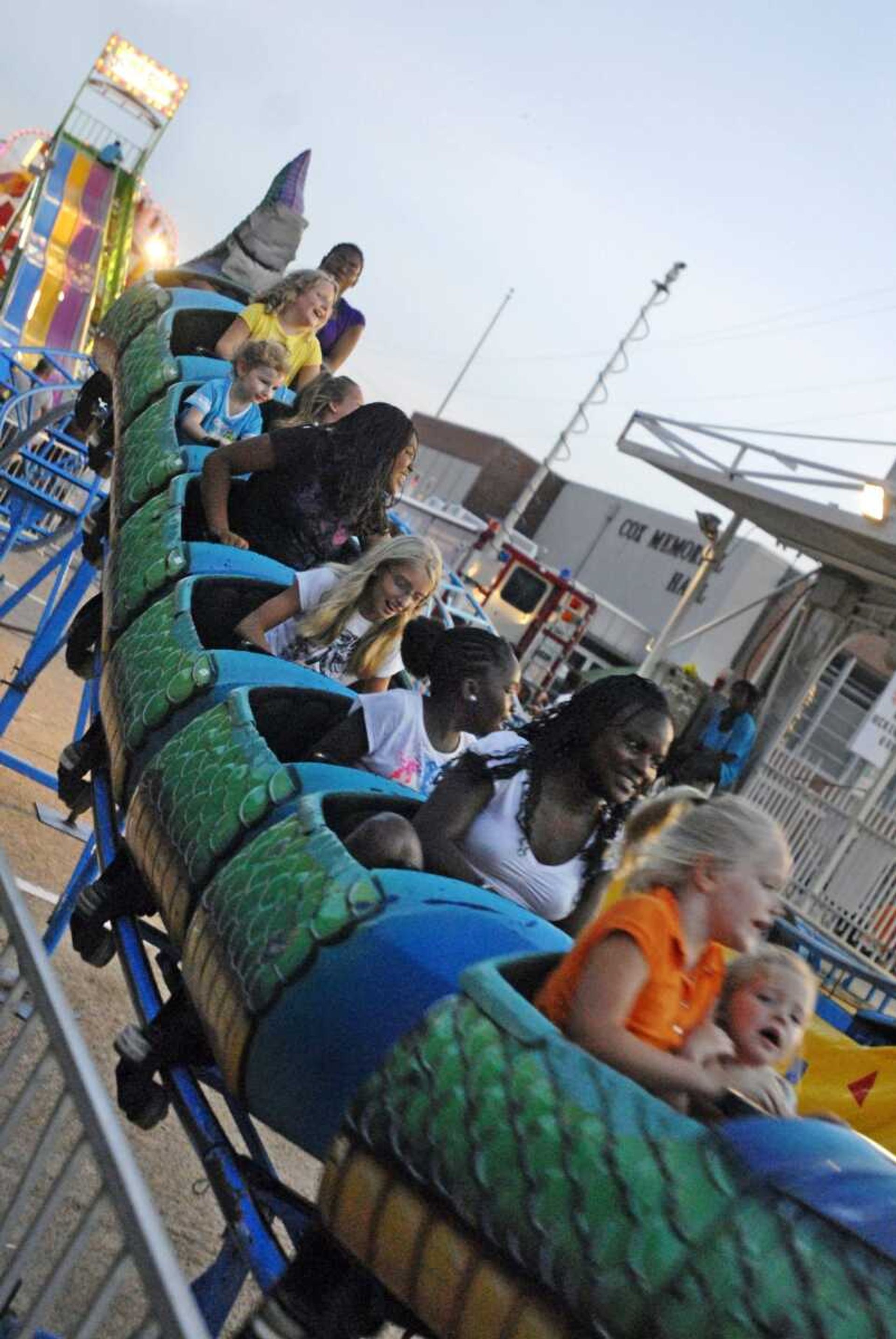 Kids enjoy the Dragon Wagon roller coaster at Homecomers in downtown Jackson on Tuesday, July 27, 2010. Tuesday marked the opening day of the celebration, which lasts through Saturday. (Kristin Eberts)