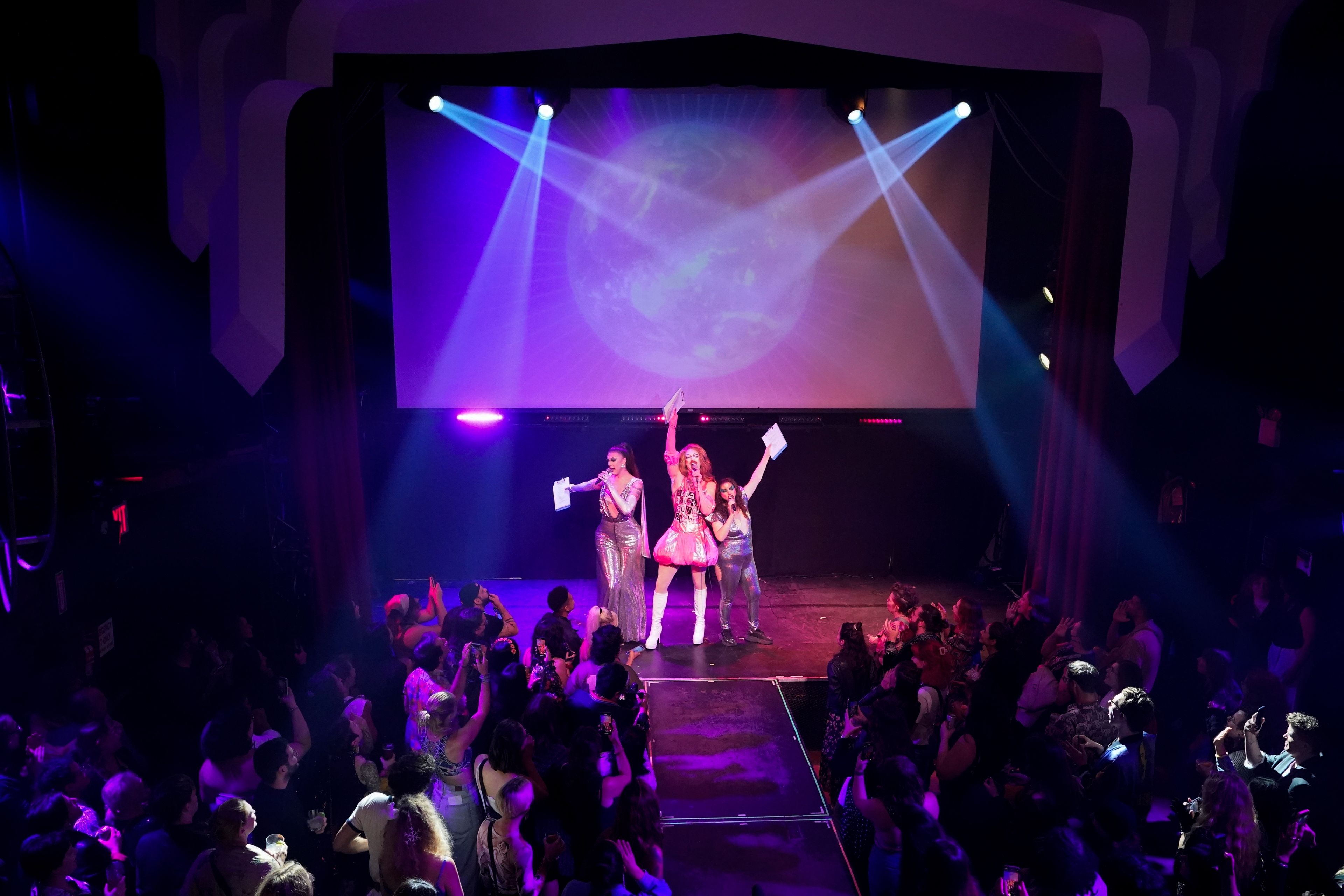 Sequoia, from left, Pattie Gonia and VERA! host the "Save Her! Environmental Drag Show", Tuesday, Sept. 24, 2024, in the Brooklyn borough of New York. (AP Photo/Alyssa Goodman)