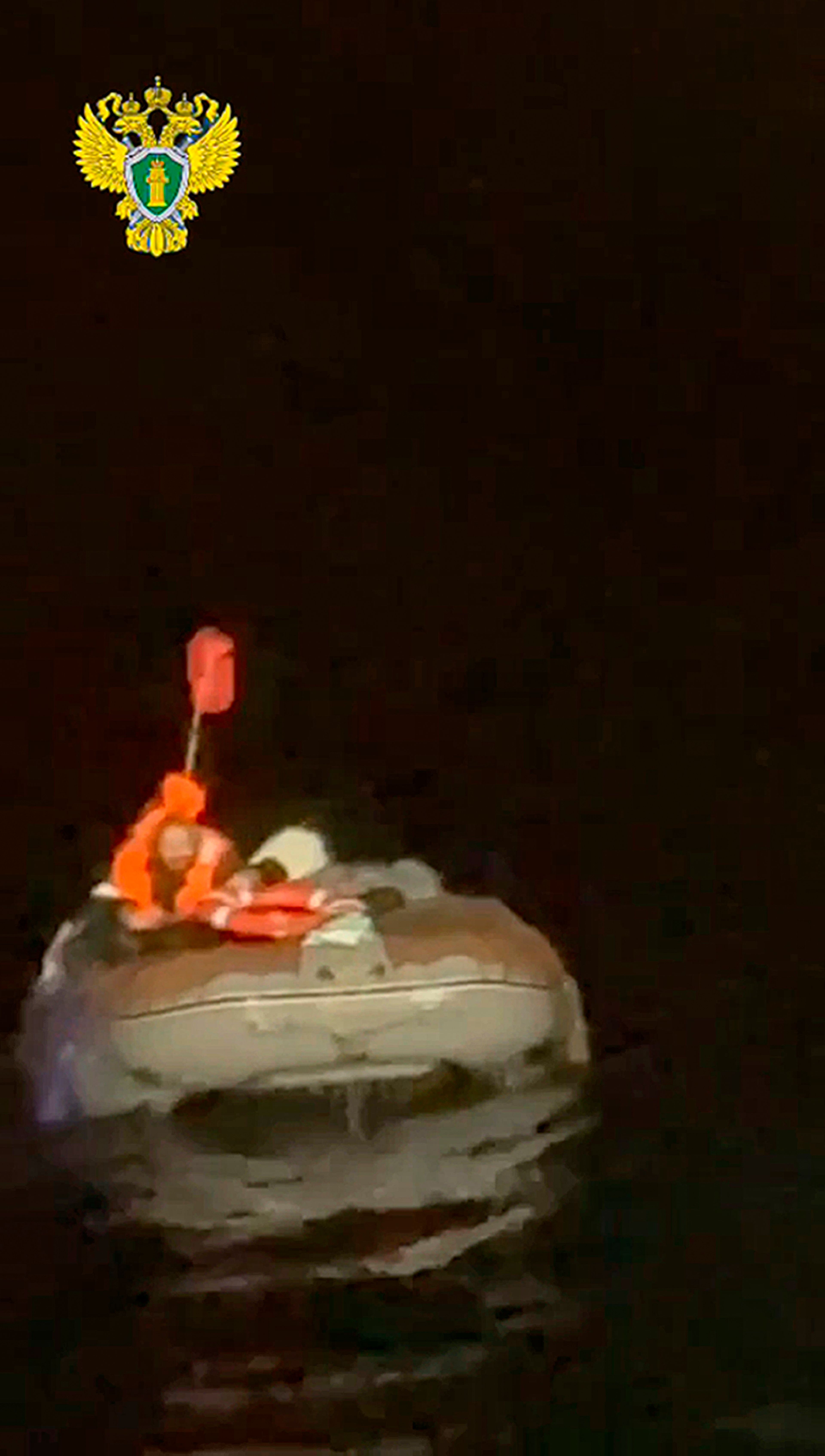 In this photo taken from video released by the official telegram channel of the Russian Far Eastern Transport Prosecutor's Office on Tuesday, Oct. 15, 2024, a Russian man who spent more than two months adrift in an inflatable boat is seen before being rescued by a fishing vessel in the Okhotsk Sea near the village of Ust-Khairuzovo in Kamchatka region of Russian far east. (Official telegram channel of the Russian Far Eastern Transport Prosecutor's Office via AP)